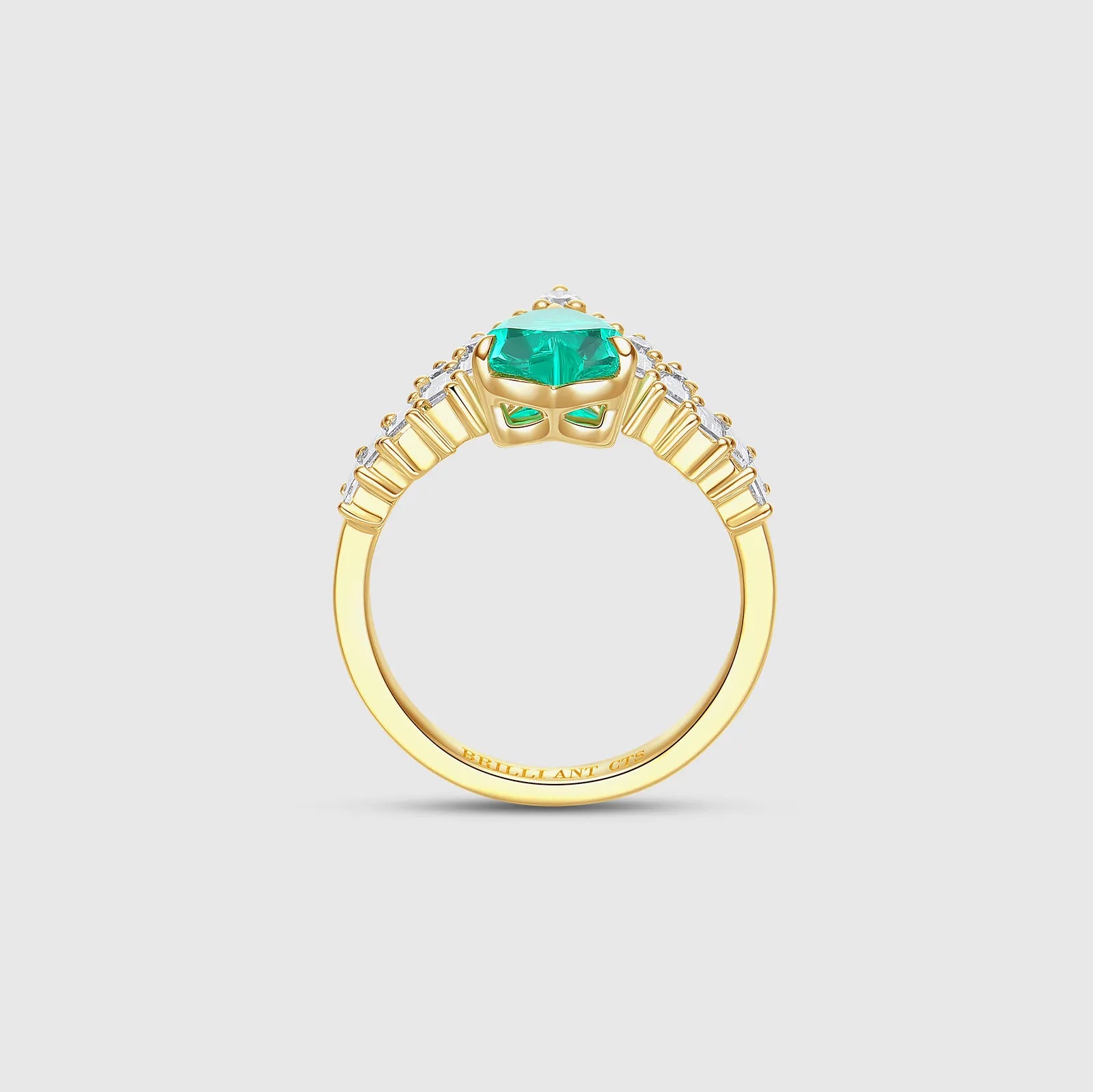 Side view of emerald and diamond ring
