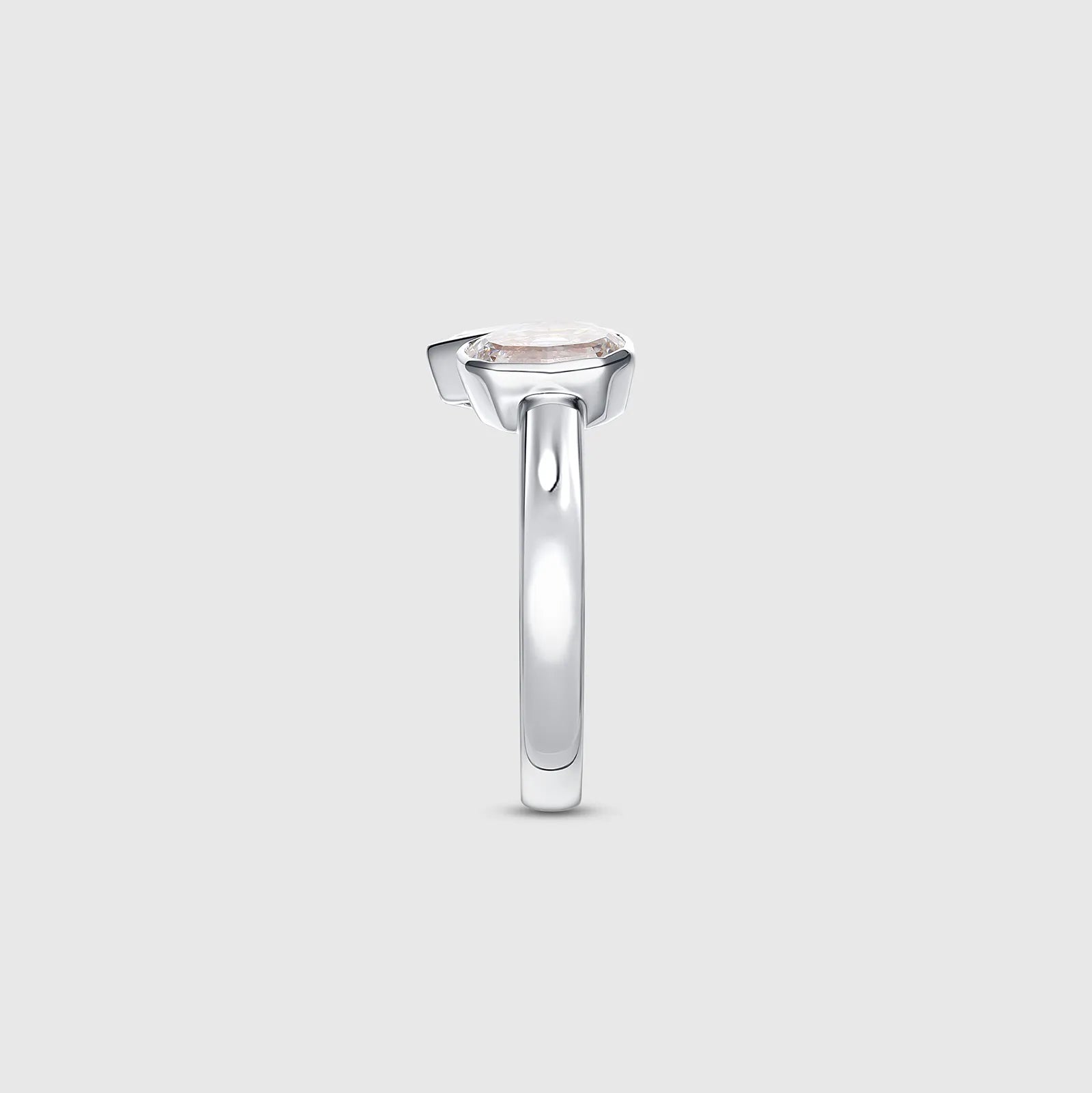 White gold ring with oval and pear cut diamonds, side view