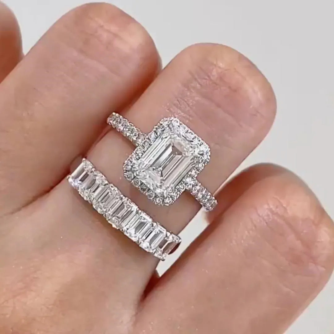 Emerald cut halo diamond engagement ring with pavé band