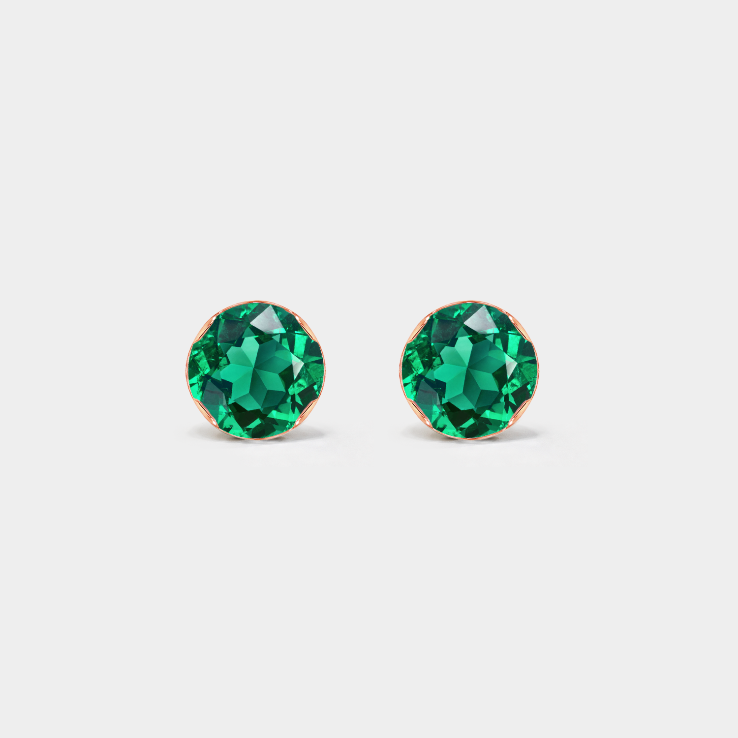 Front view of round lab-grown emerald stud earrings in rose gold.
