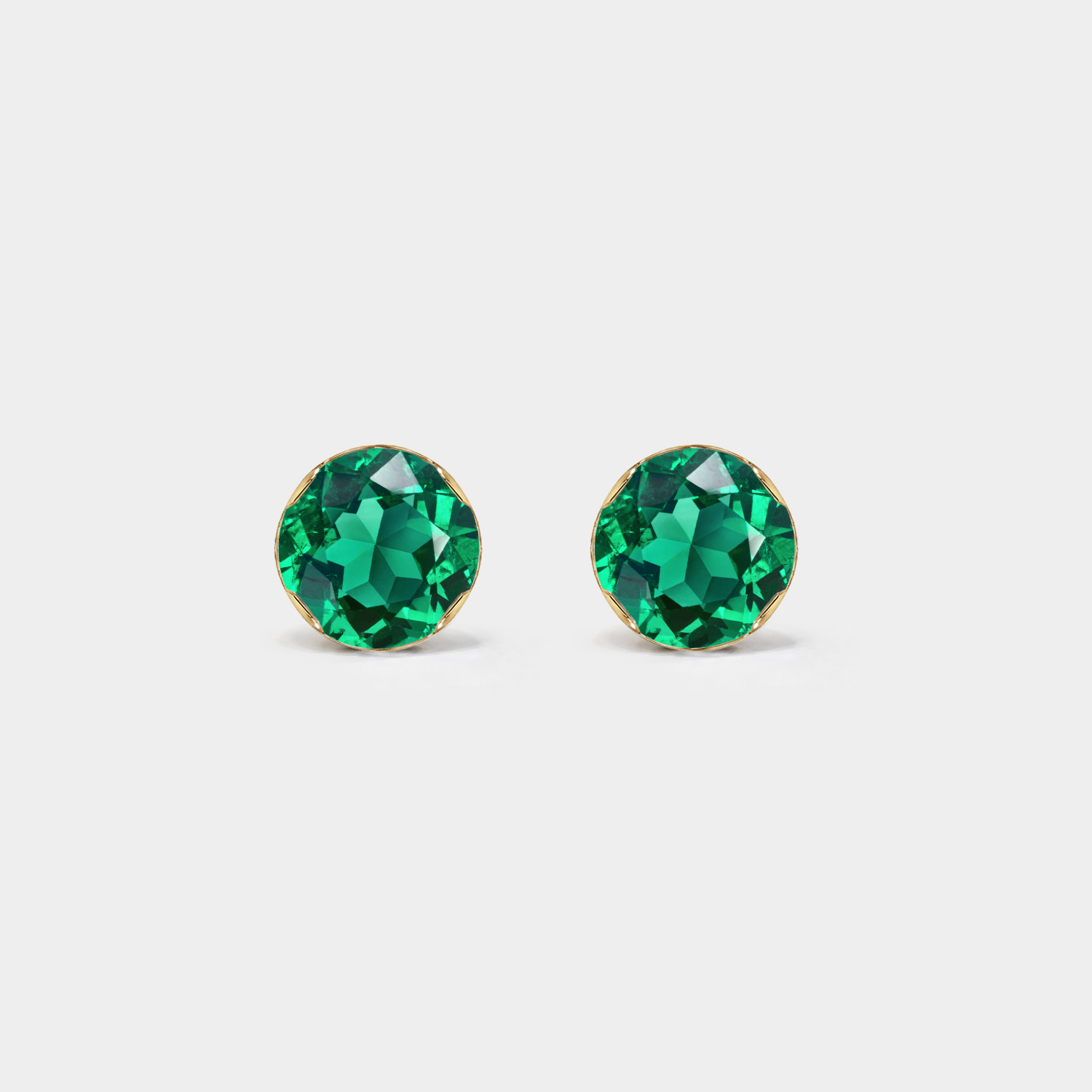 Front view of round lab-grown emerald stud earrings in yellow gold.