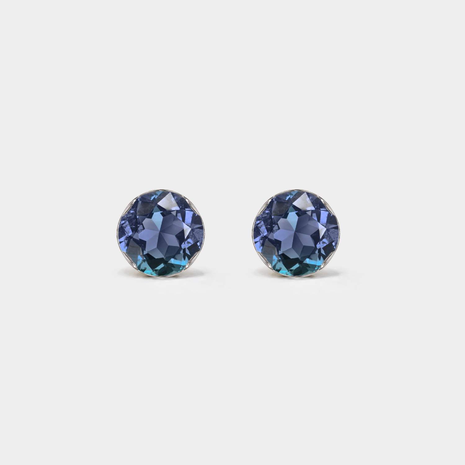 Front view of round lab-grown alexandrite stud earrings in white gold on a white background.