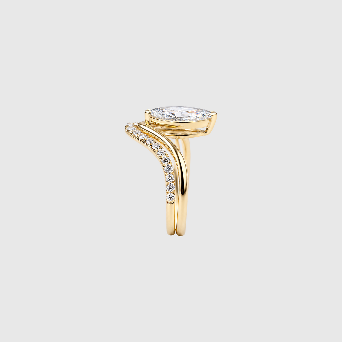Marquise lab-grown diamond two-piece ring set in yellow gold, side view.