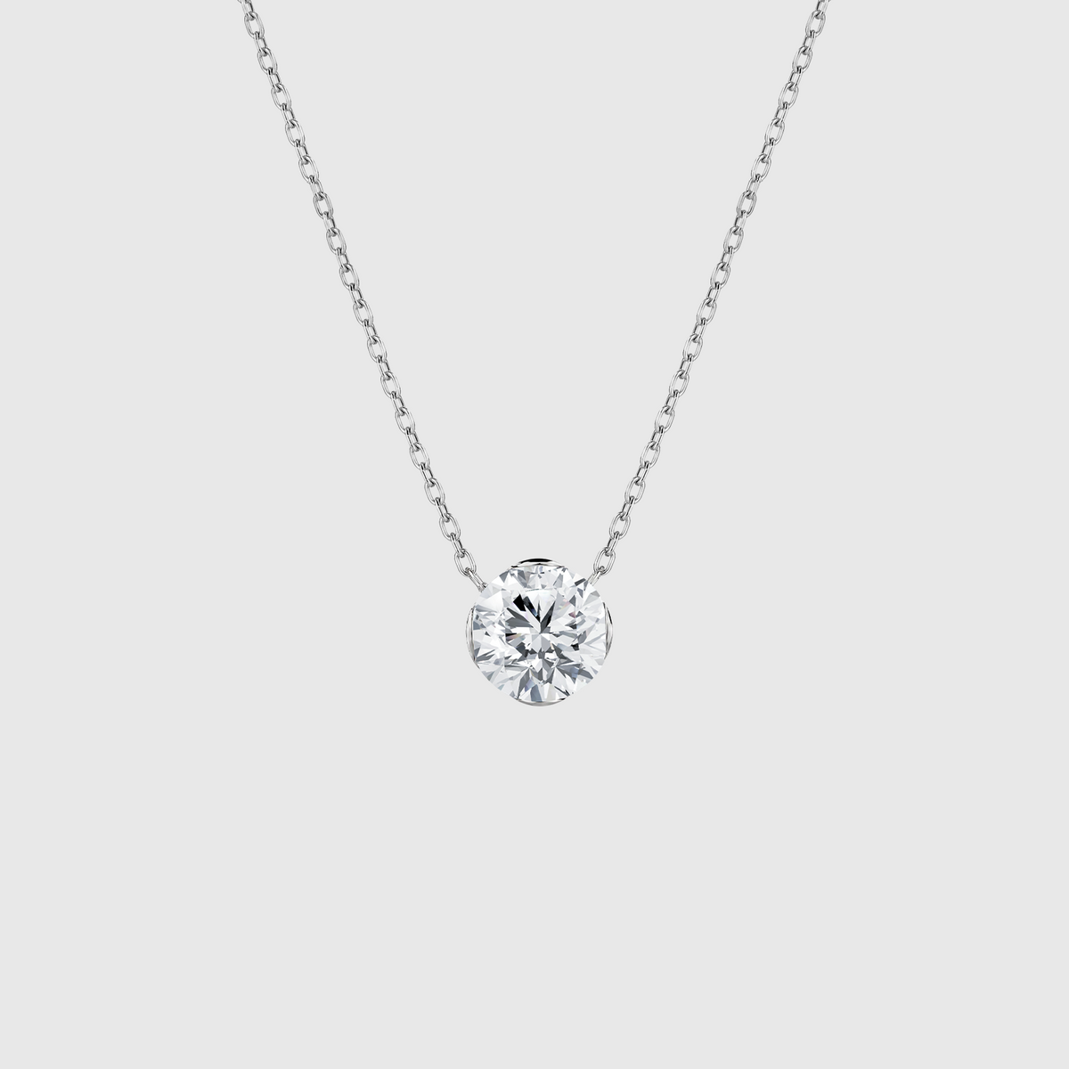 White gold round diamond solitaire necklace front view.