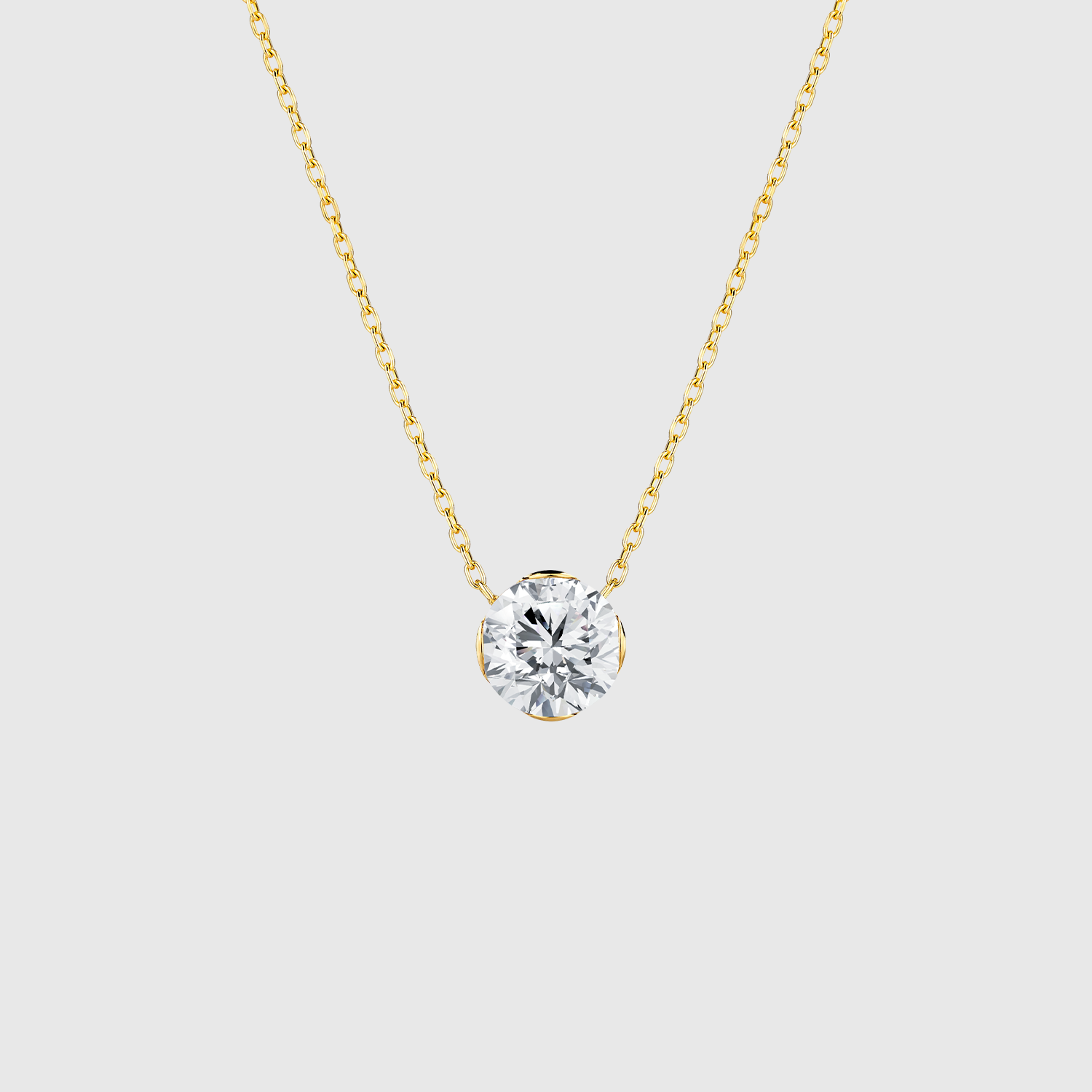 Yellow gold round diamond solitaire necklace front view.
