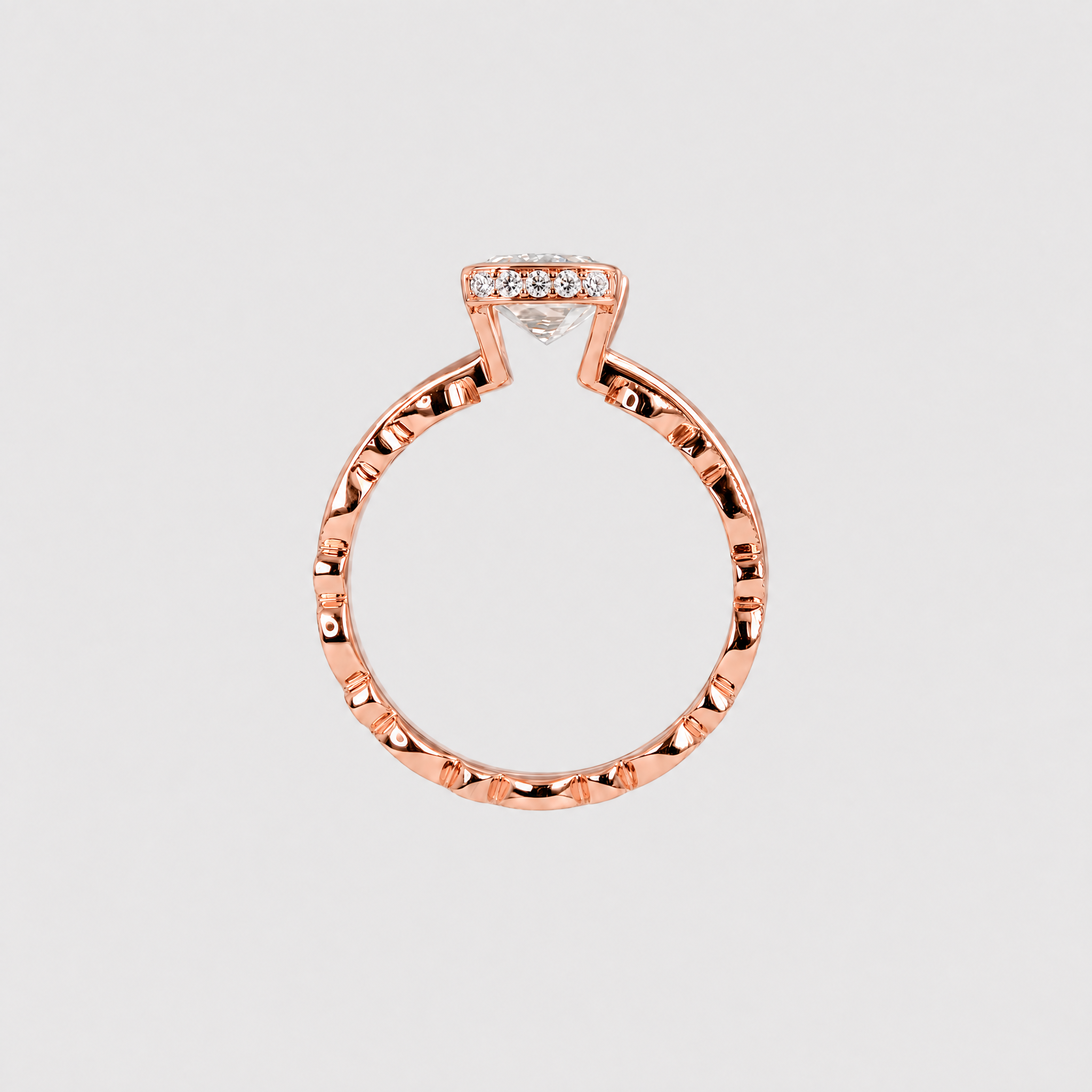 Back profile of a rose gold bridal set showing the open center setting and two stacked bands.