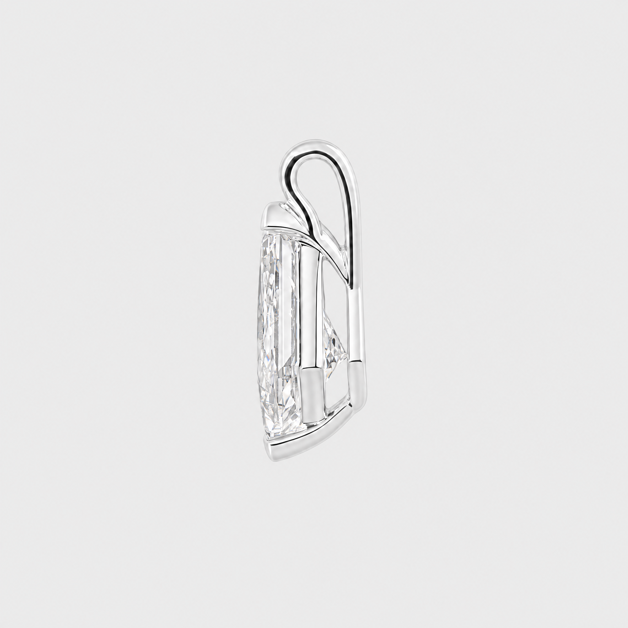 Side view of a kite-cut solitaire pendant in white metal showing the open setting and bail.