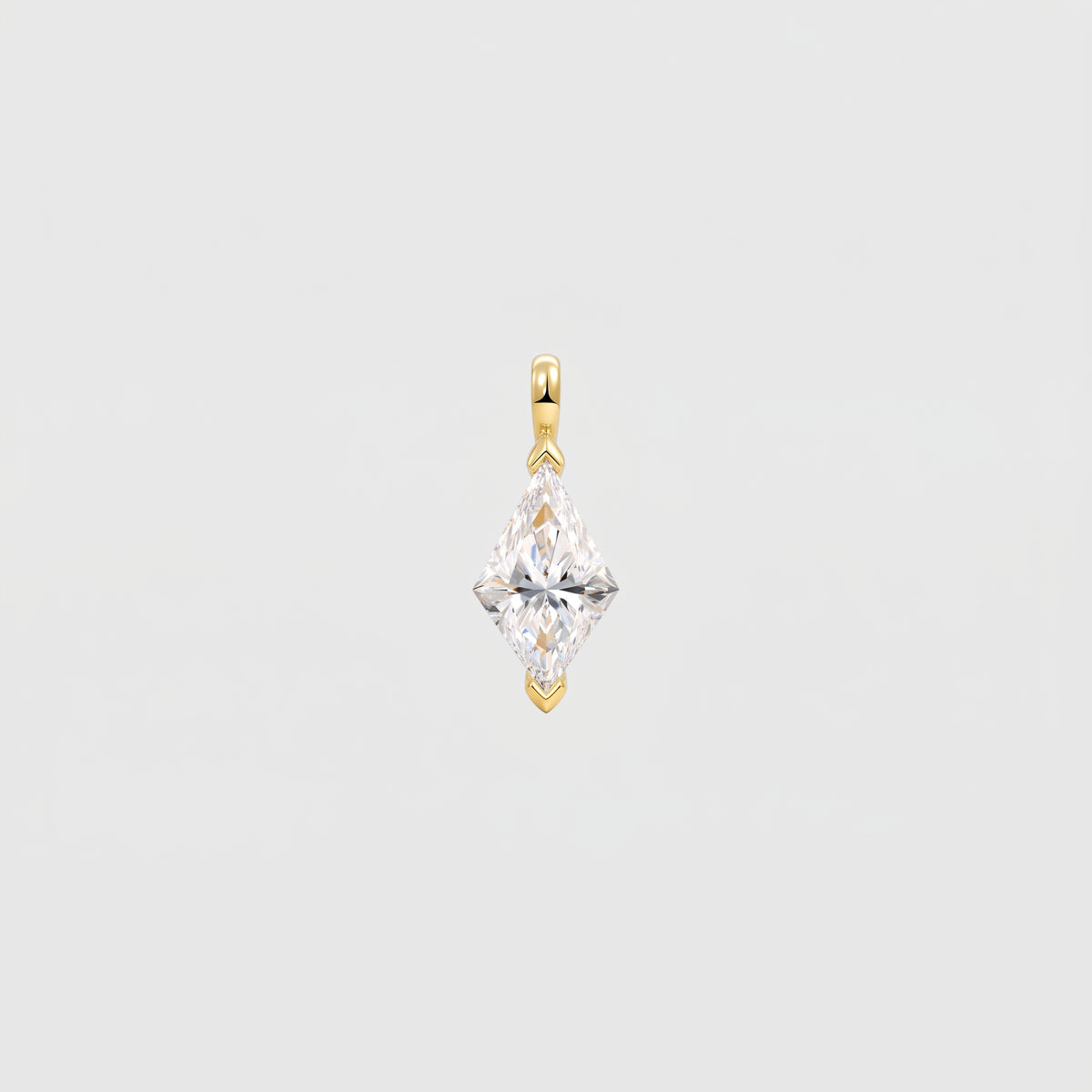 Front view of a kite-cut solitaire pendant in yellow gold with protective tip prongs.