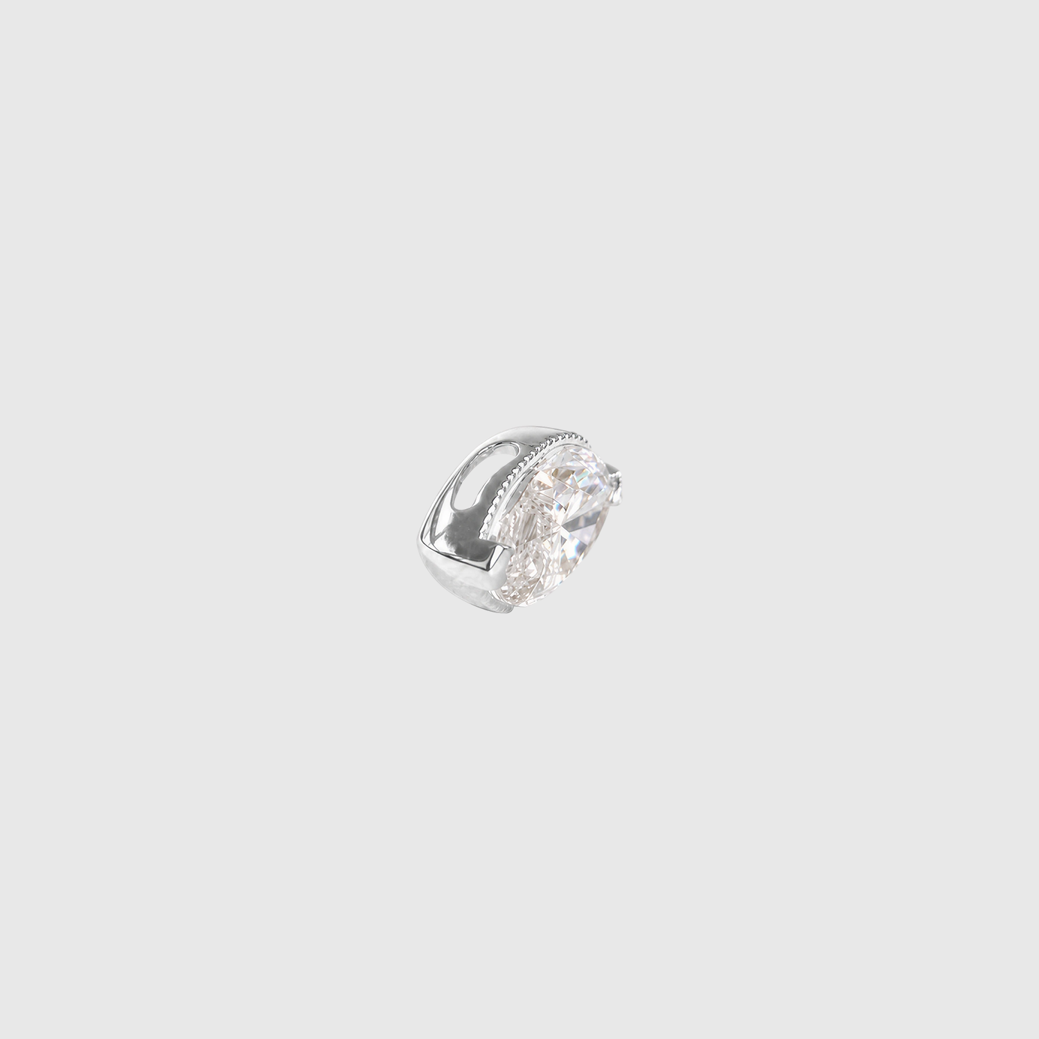 Side view of a marquise-cut diamond pendant in white gold showing the bezel profile and concealed bail.