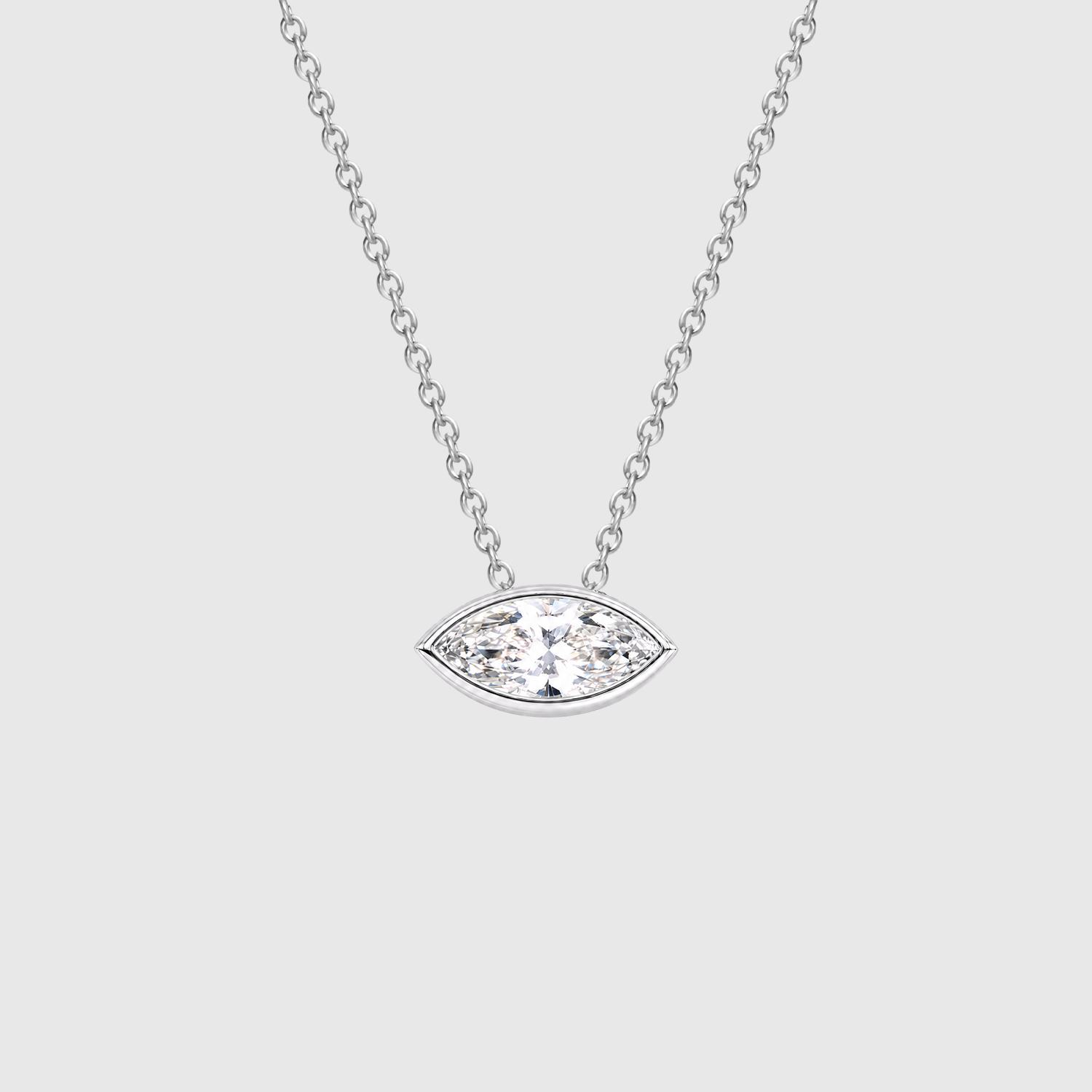 White gold east-west marquise diamond pendant displayed on a chain.