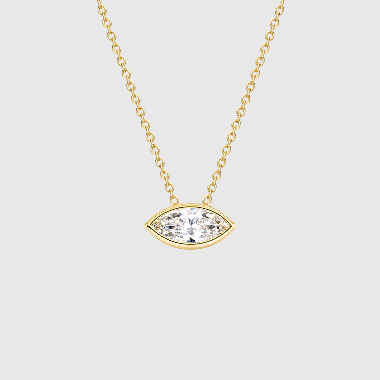 Yellow gold east-west marquise diamond pendant displayed on a chain.