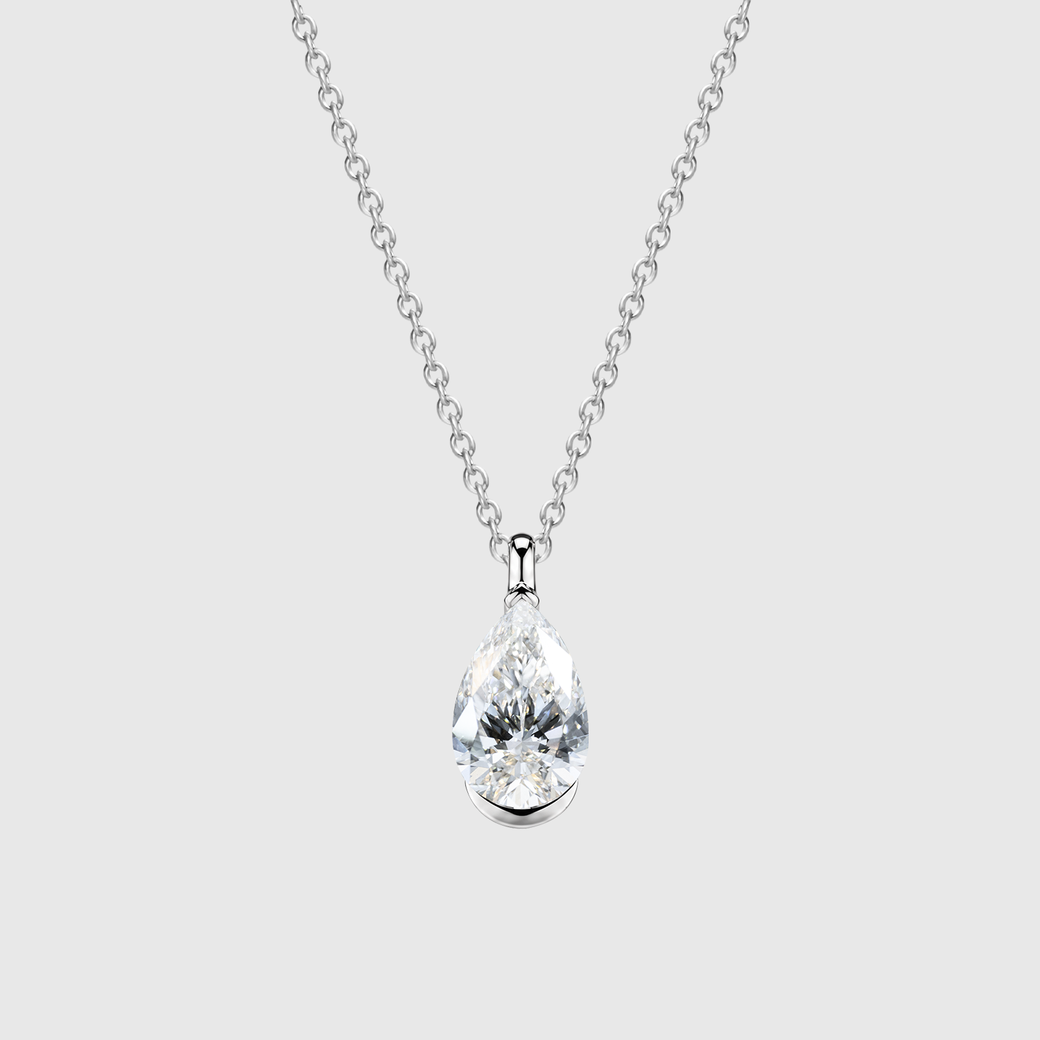 Pear-cut diamond pendant in white gold displayed on a matching fine chain.