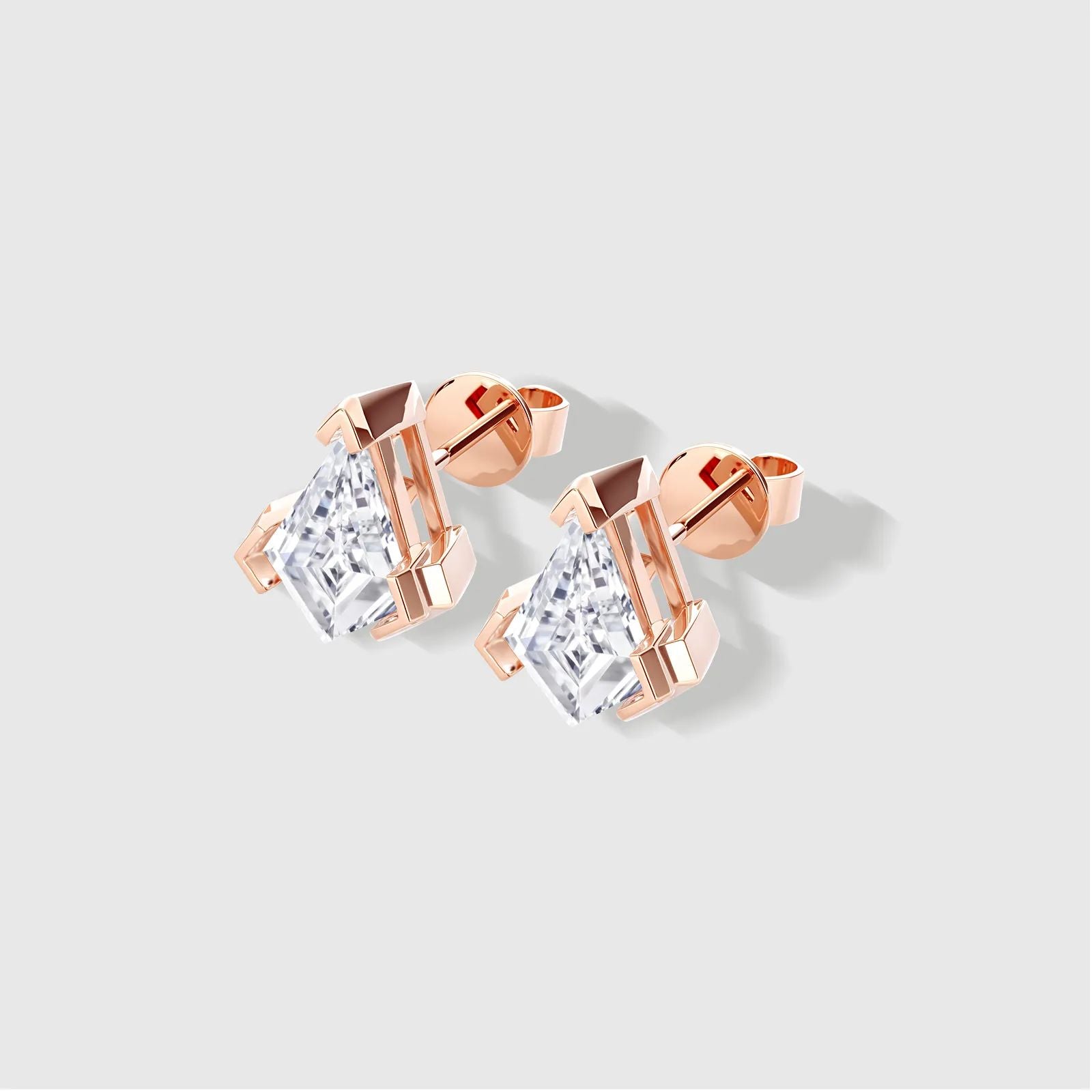 Rose gold kite-cut diamond earrings. Sustainable fine jewelry