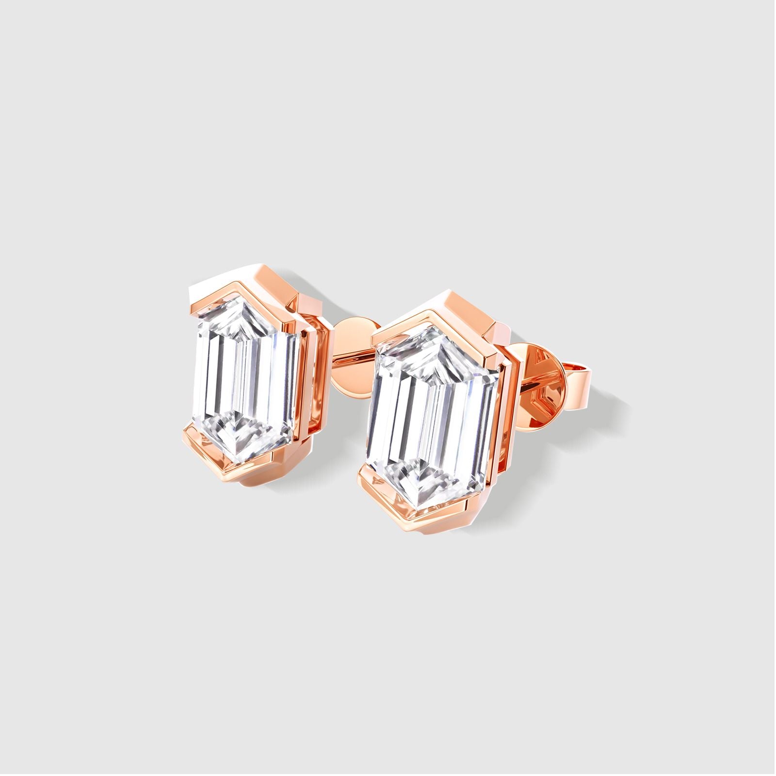 Rose gold hexagon diamond stud earrings. Geometric design