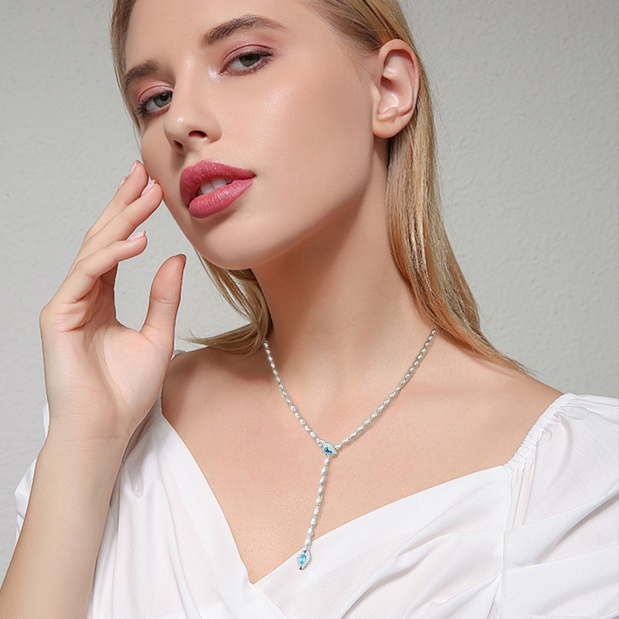 Aquamarine snake pendant necklace on a woman
