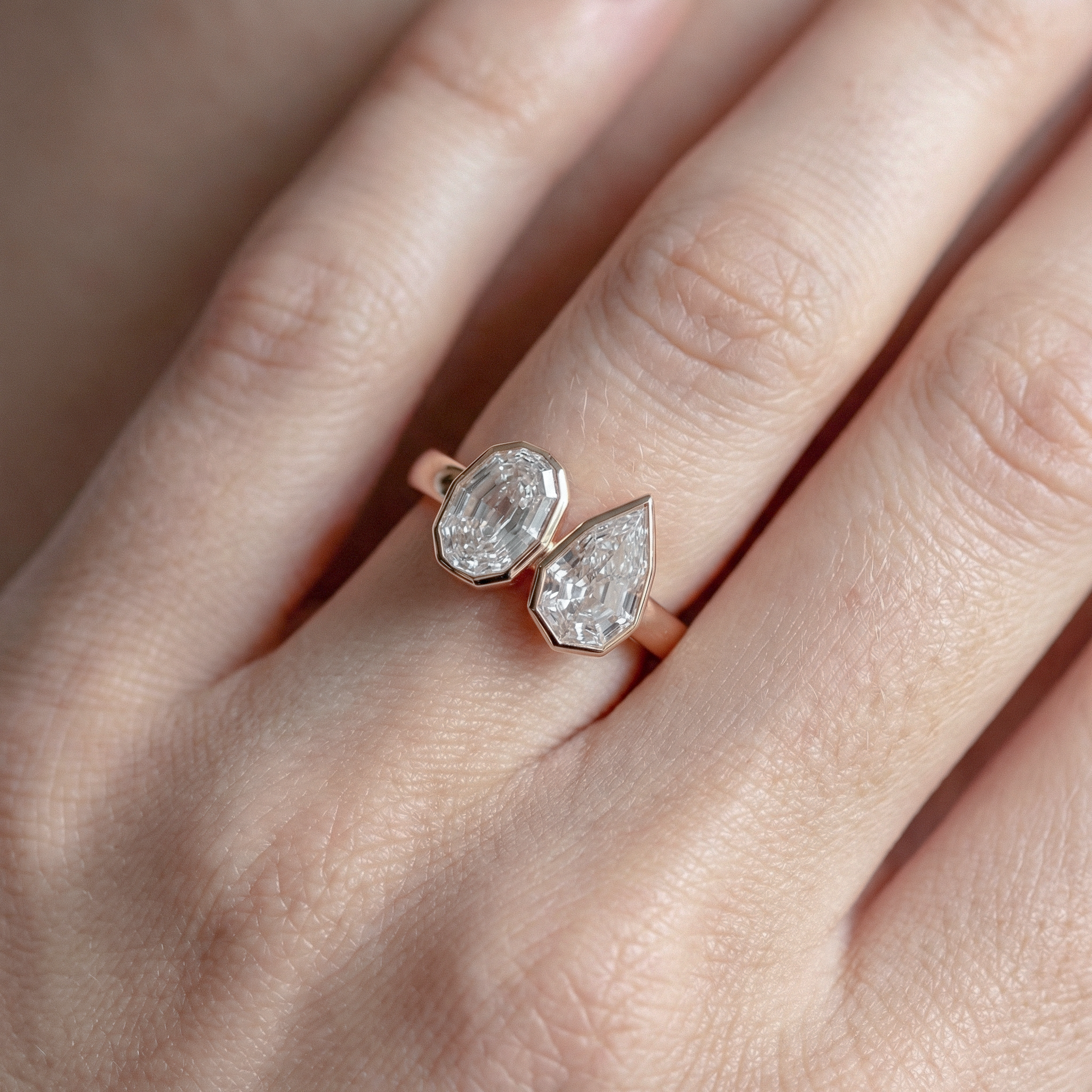 Rose gold ring with two diamond on a hand