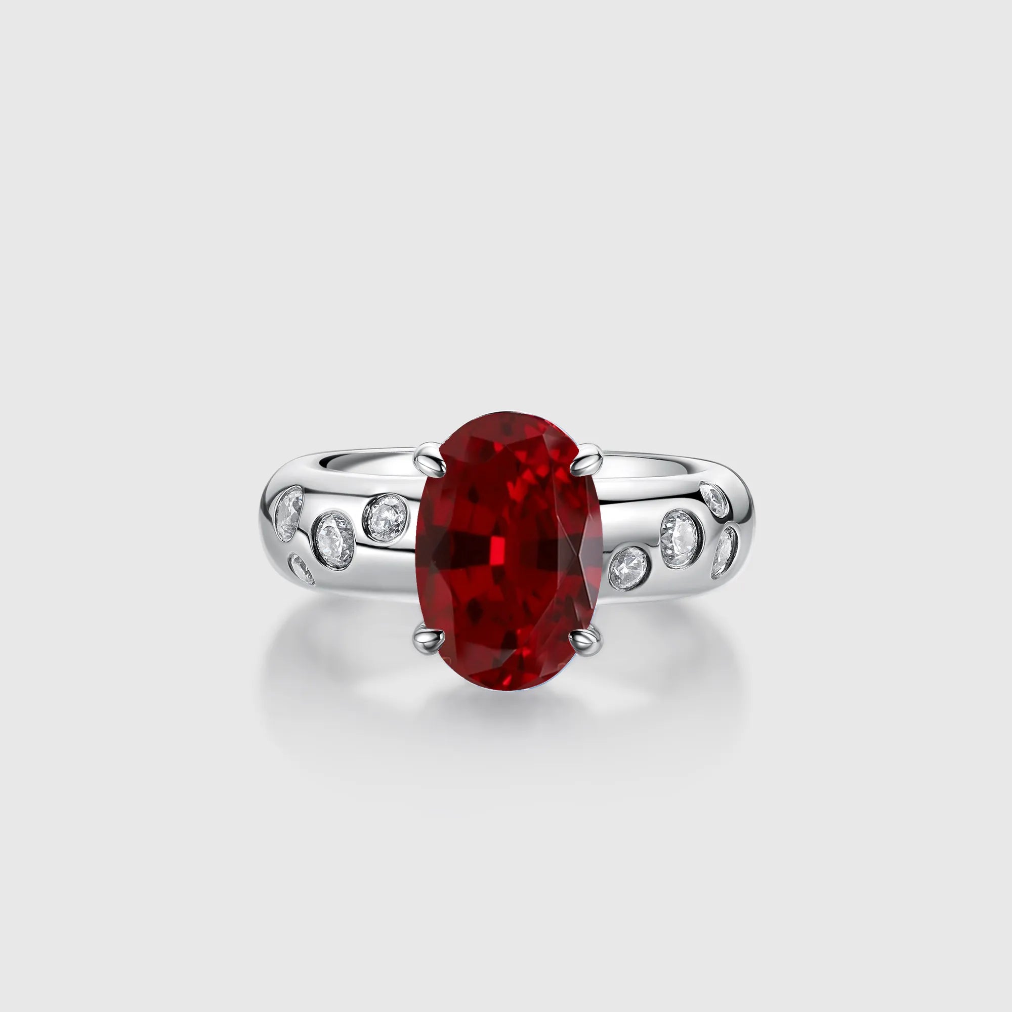 Oval Ruby Engagement Ring with Bezel Side Stones