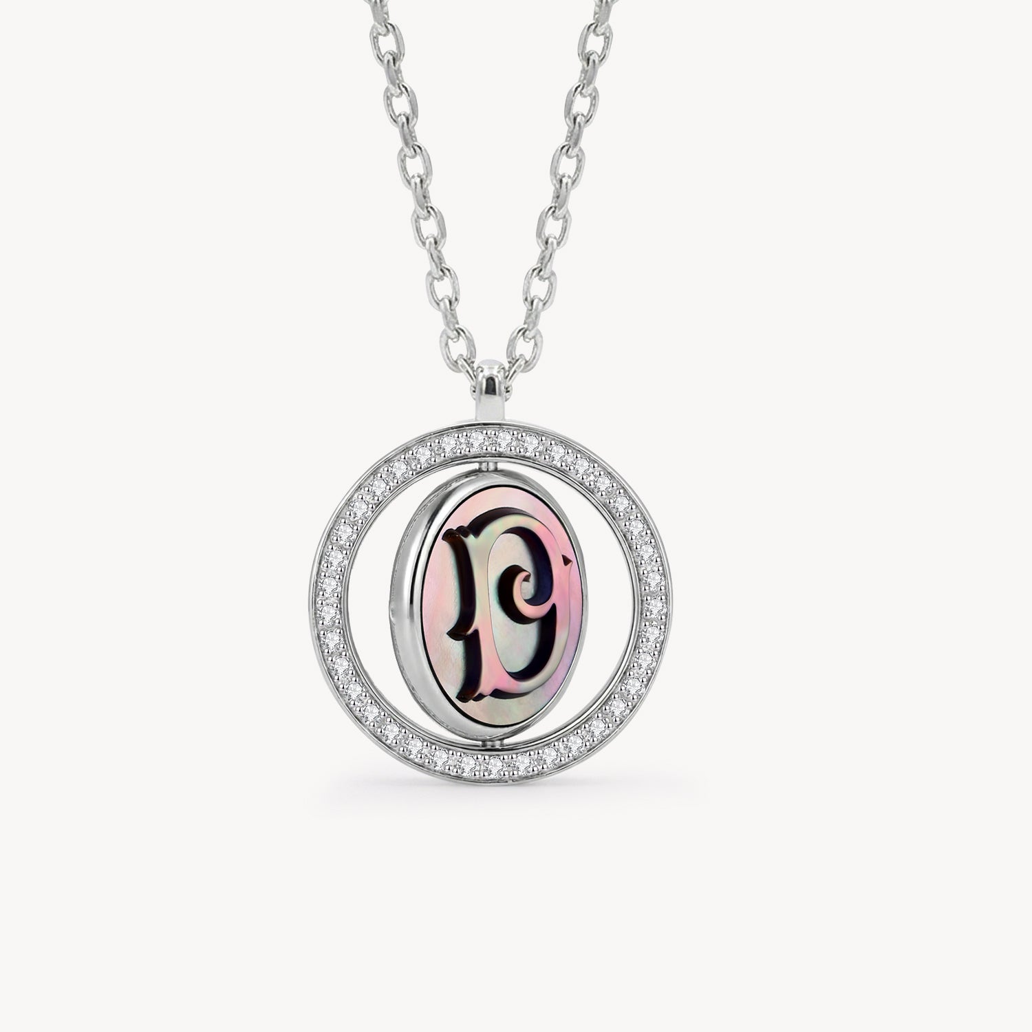 Reversible personalized initial diamond necklace with a black mother-of-pearl background, shown on a 925 sterling silver chain.