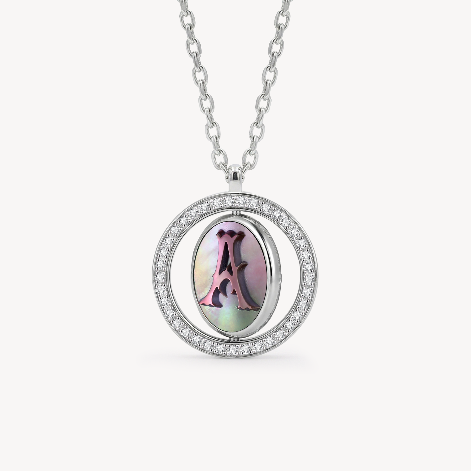 Reversible personalized initial diamond necklace with a black mother-of-pearl background, shown on a 925 sterling silver chain.