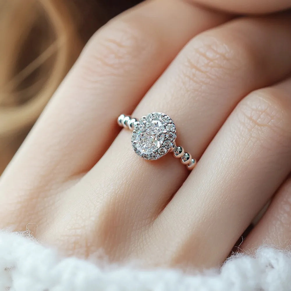 Elegant Oval diamond engagement ring with beaded band
