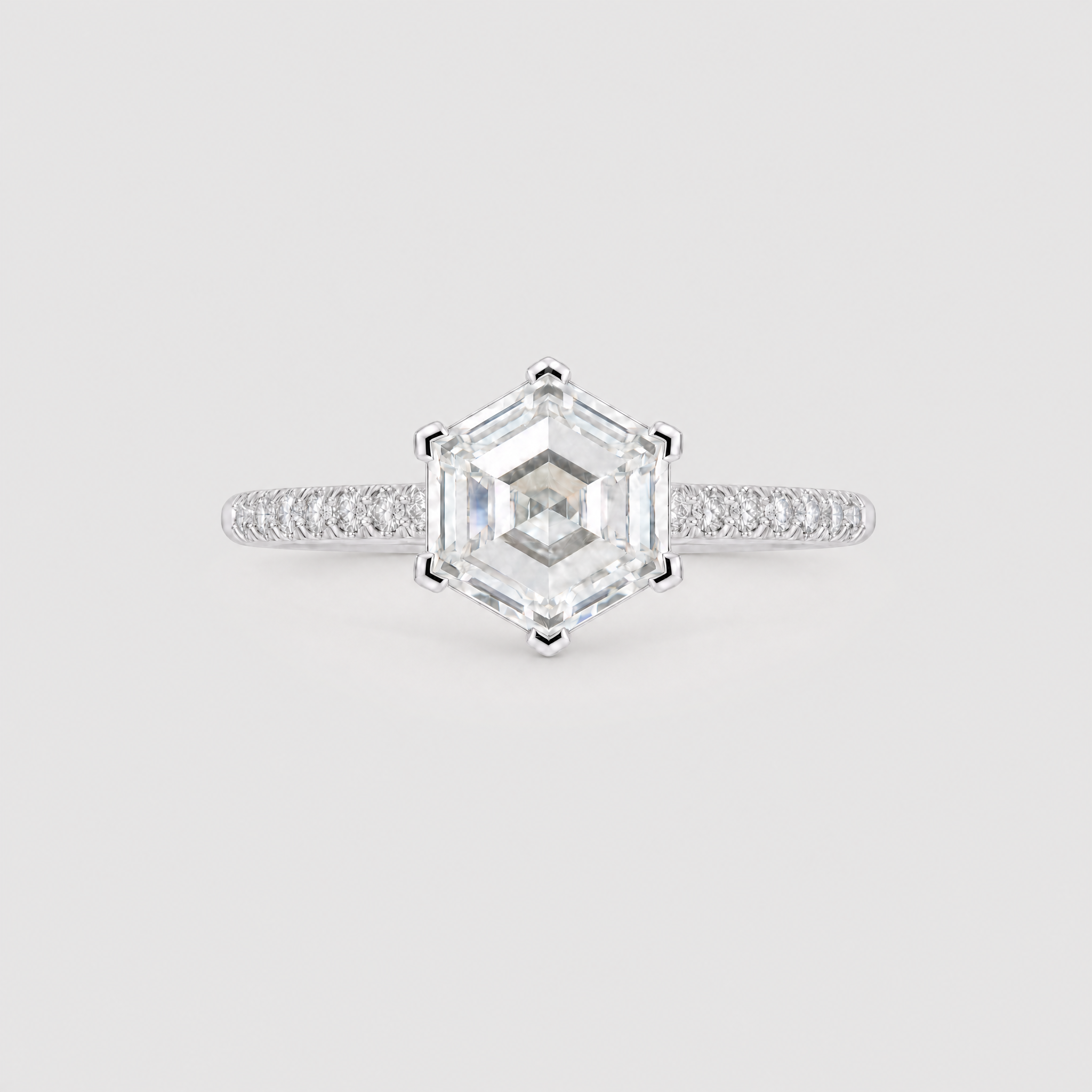 front view of a hexagon diamod ring with pave band in white gold 