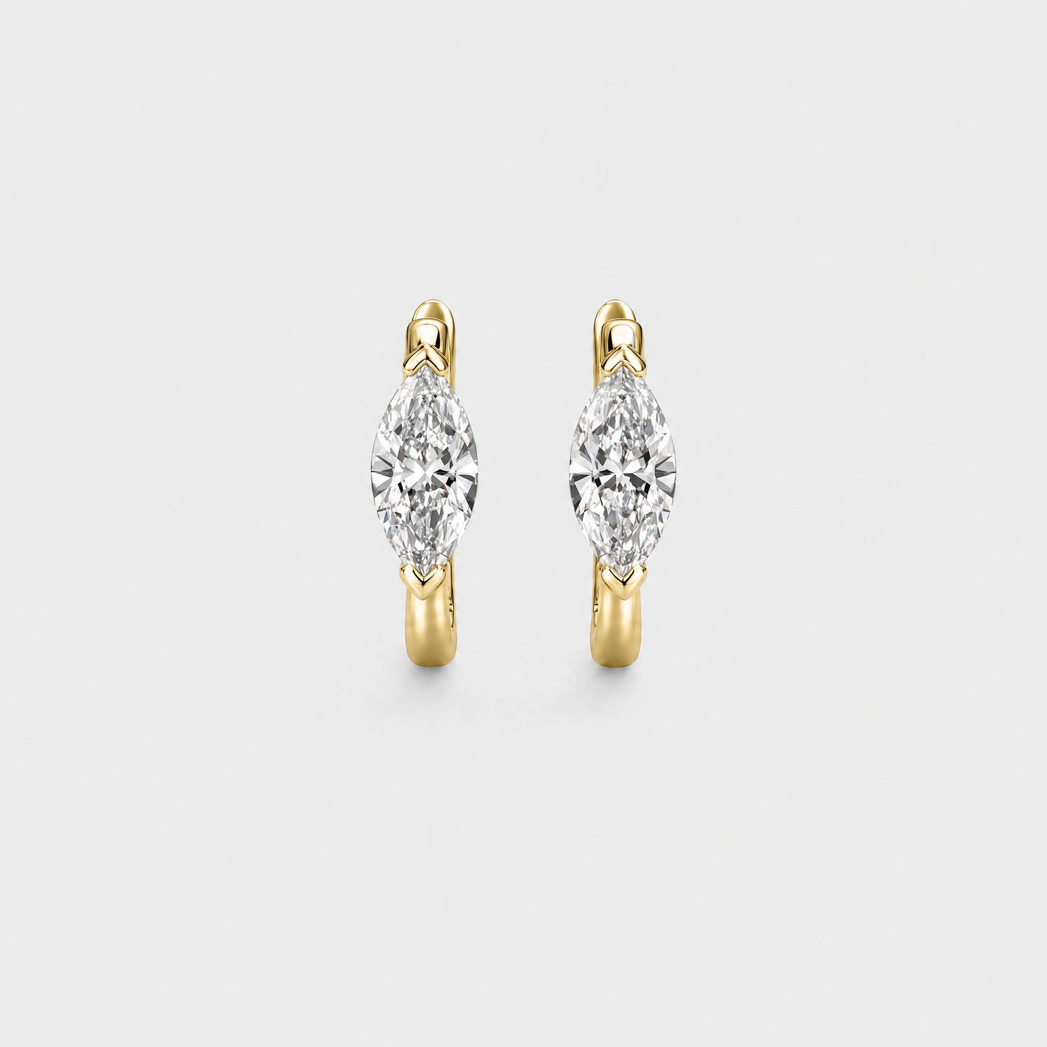 Front view of marquise-cut hoop earrings in yellow gold on a white background.
