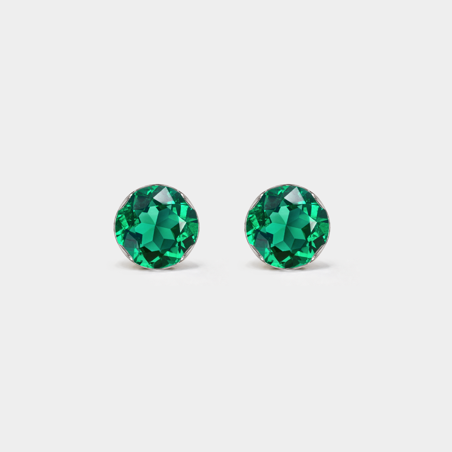 Front view of round lab-grown emerald stud earrings in white gold.