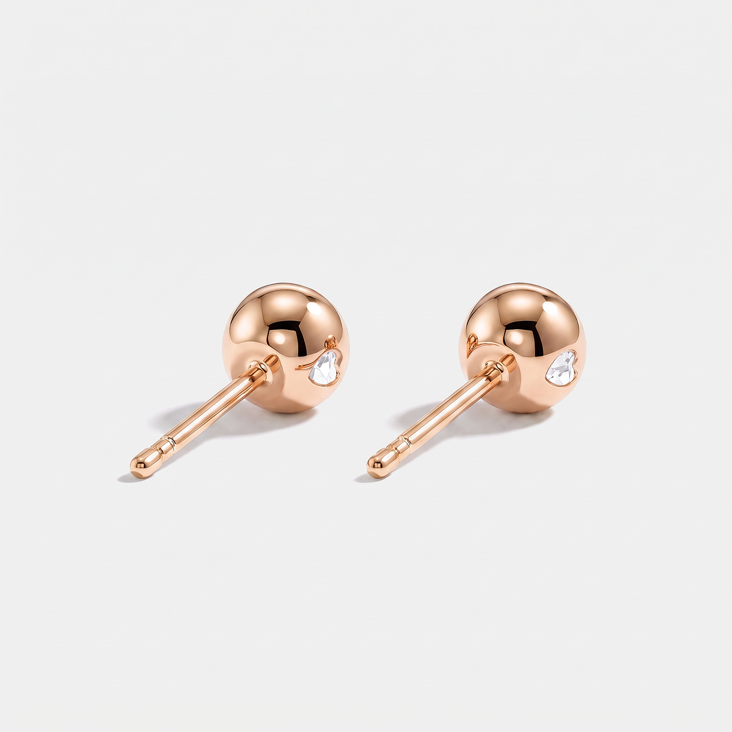 Round stone stud earrings in rose gold, back view