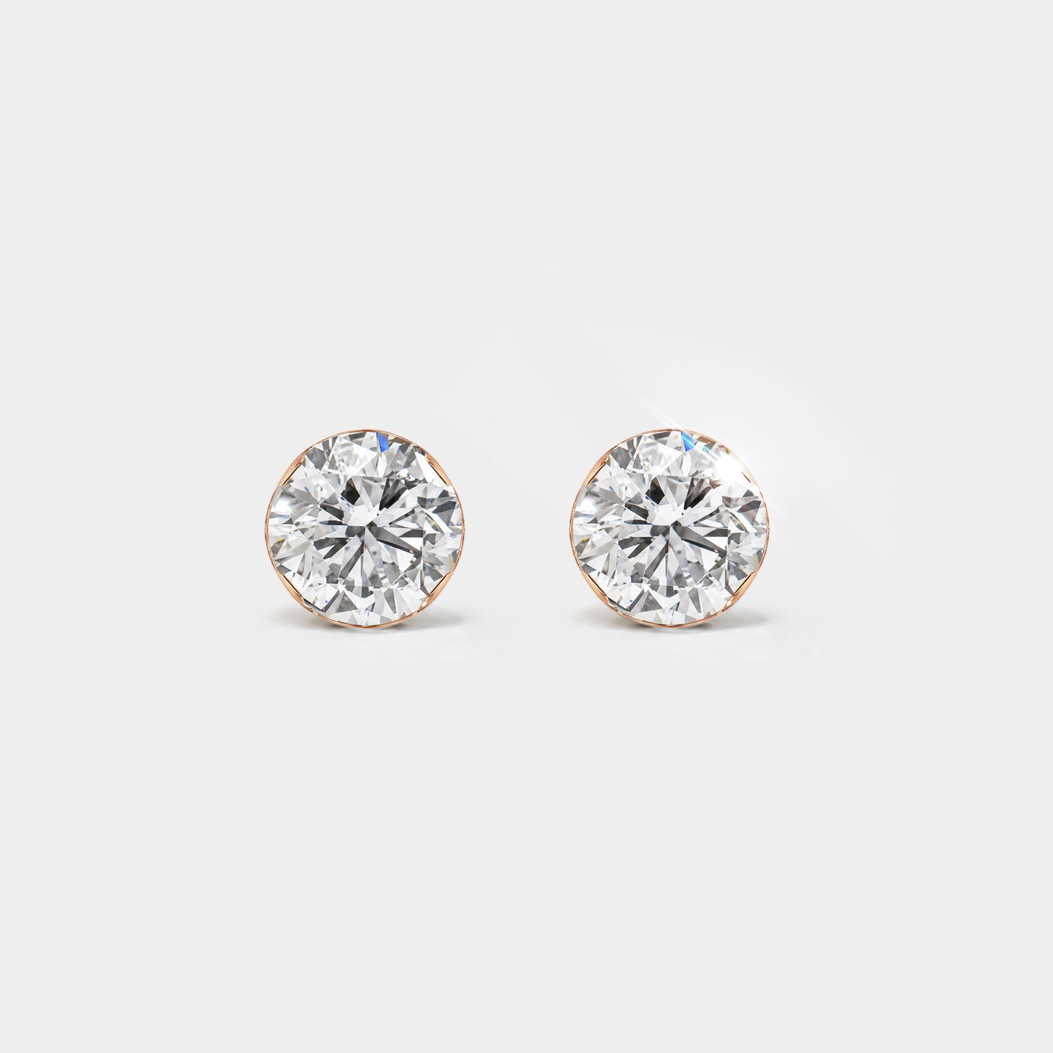 Round stone stud earrings in rose gold, front view