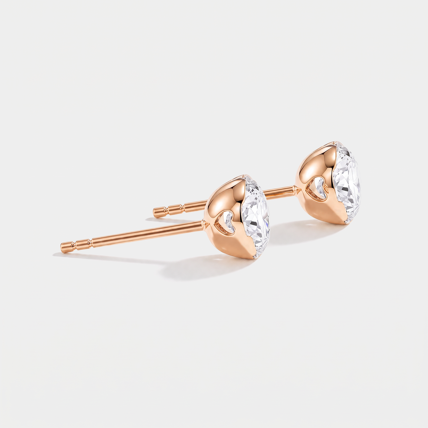Round stone stud earrings in rose gold, side view