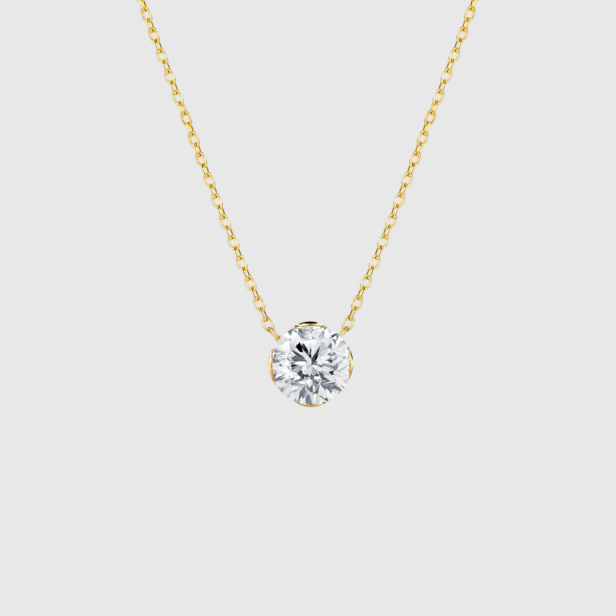 Yellow gold round diamond solitaire necklace front view.