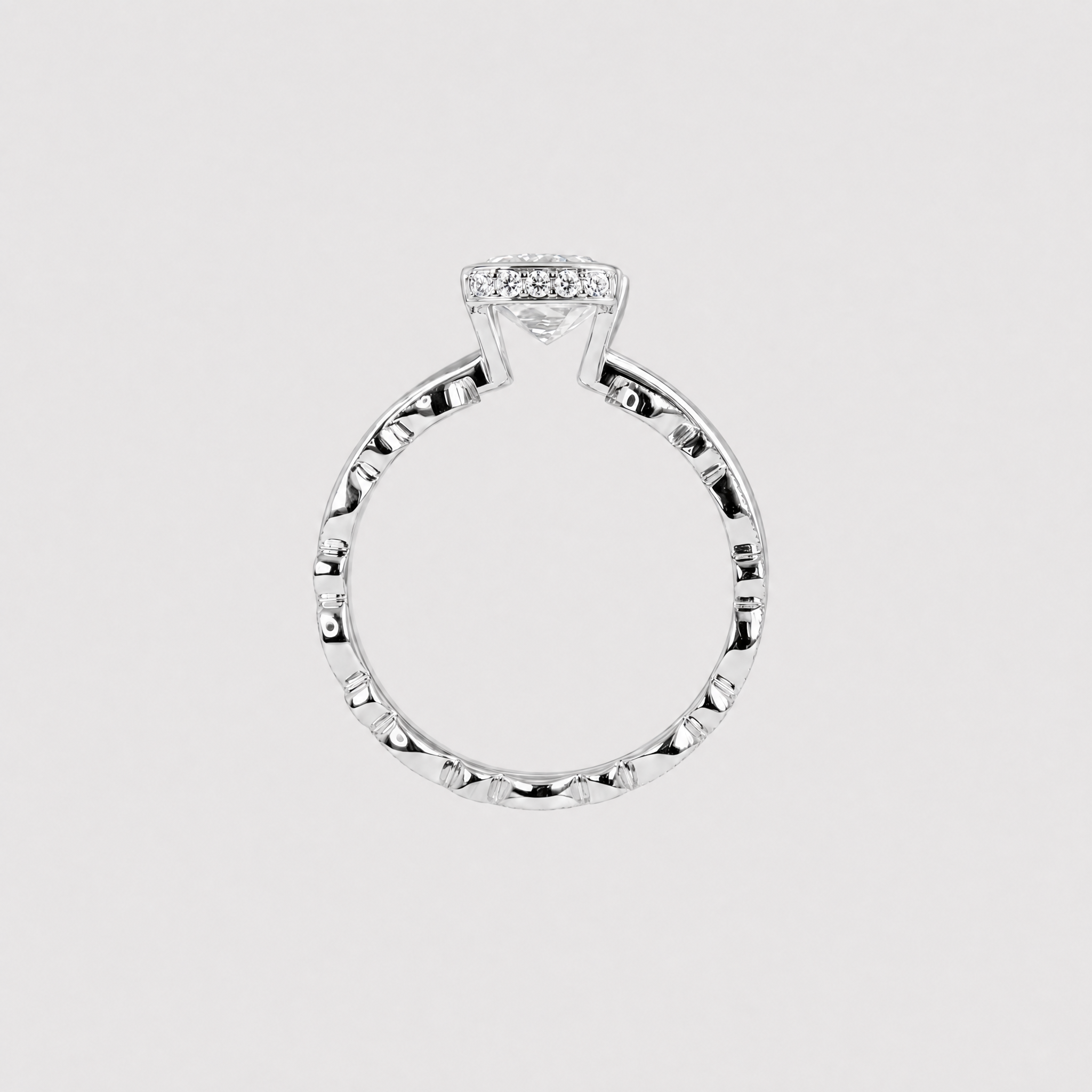 Back profile of a white-metal bridal set showing the open center setting and two stacked bands.