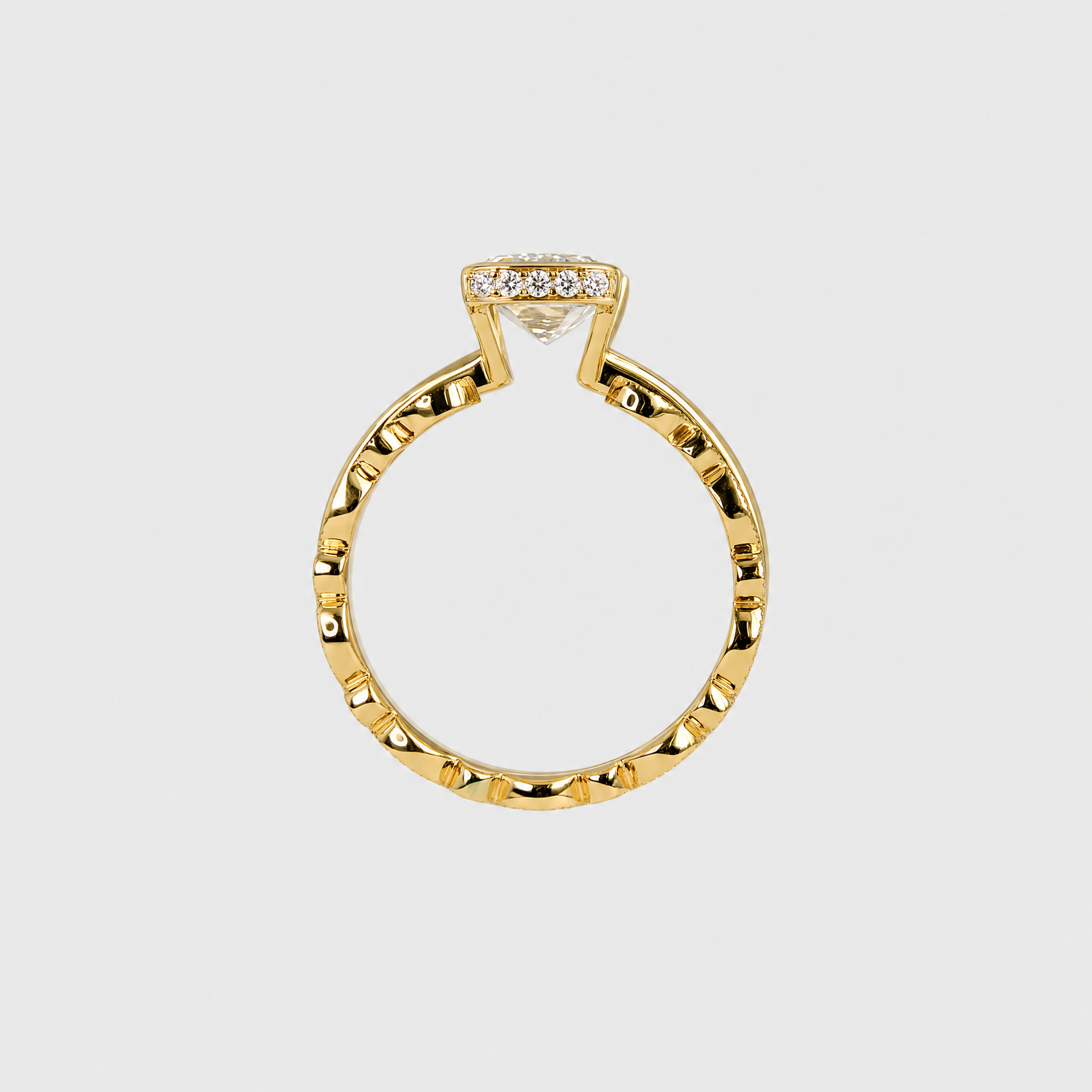 Back profile of a yellow gold bridal set showing the open center setting and two stacked bands.