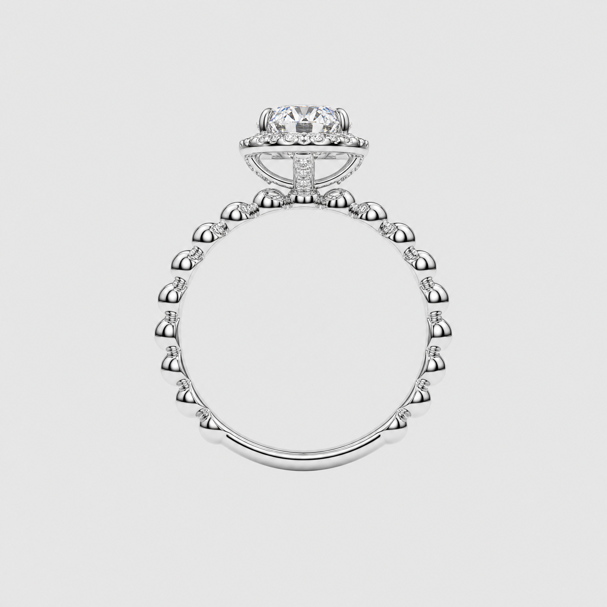 Back profile of an oval halo engagement ring showing the raised white-metal setting and beaded band.