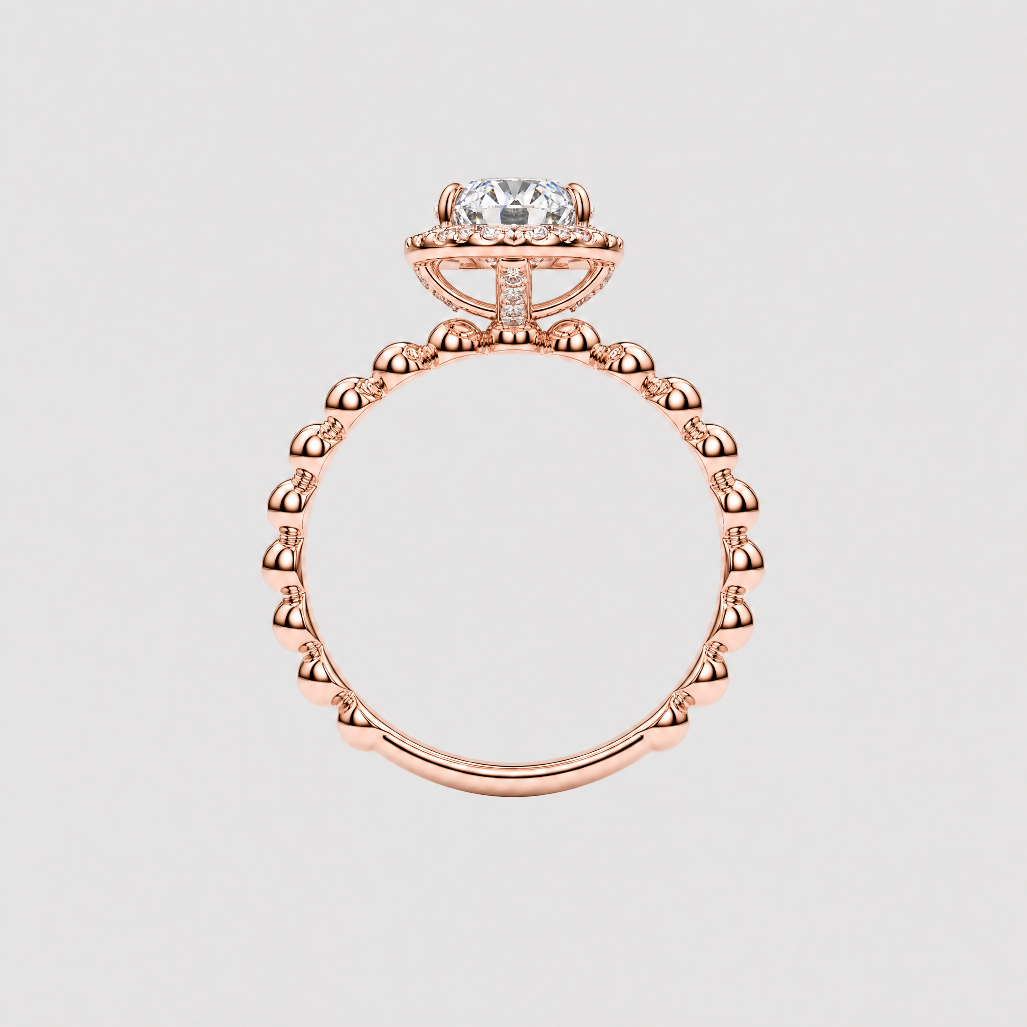 Back profile of an oval halo engagement ring showing the raised rose gold setting and beaded band.