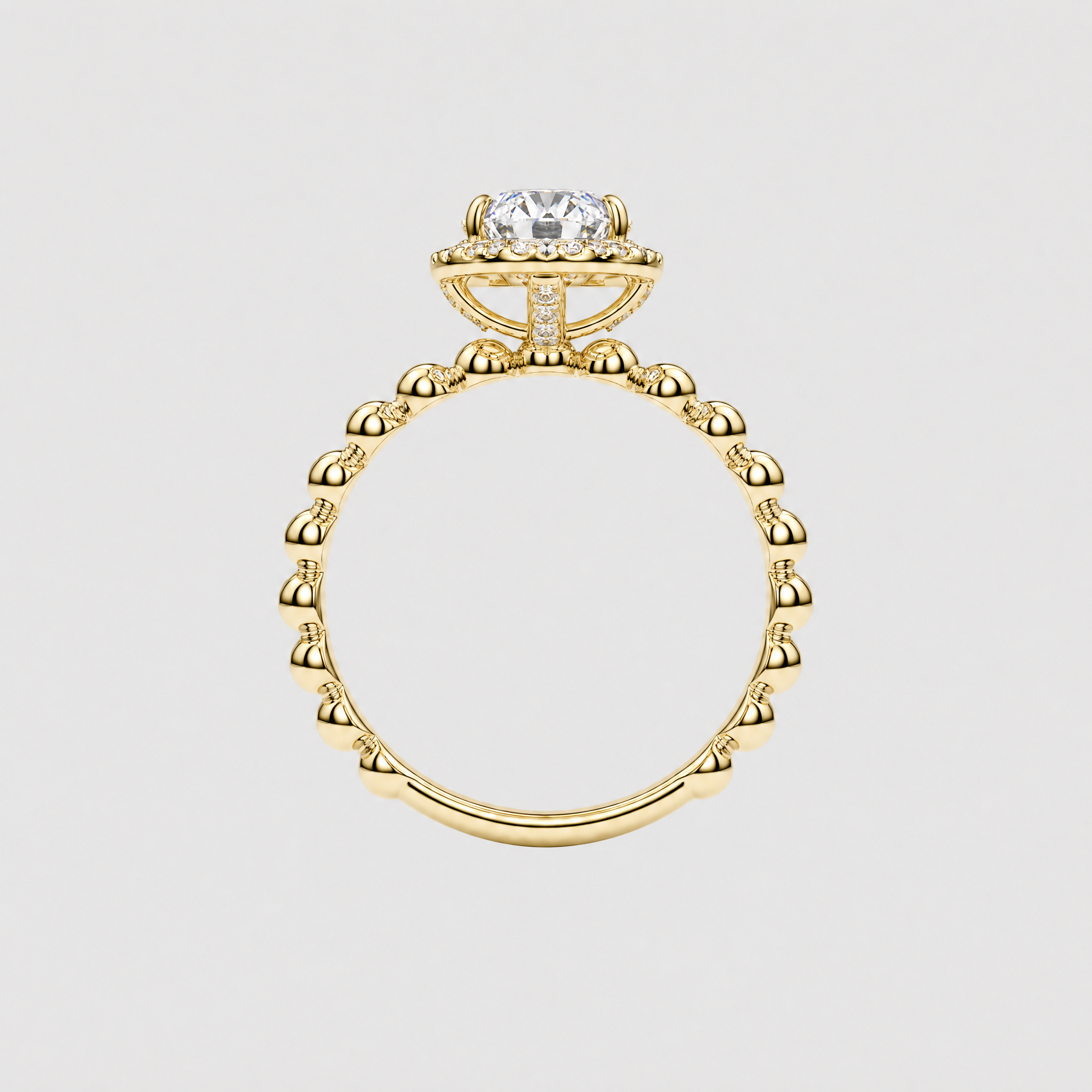 Back profile of an oval halo engagement ring showing the raised yellow gold setting and beaded band.
