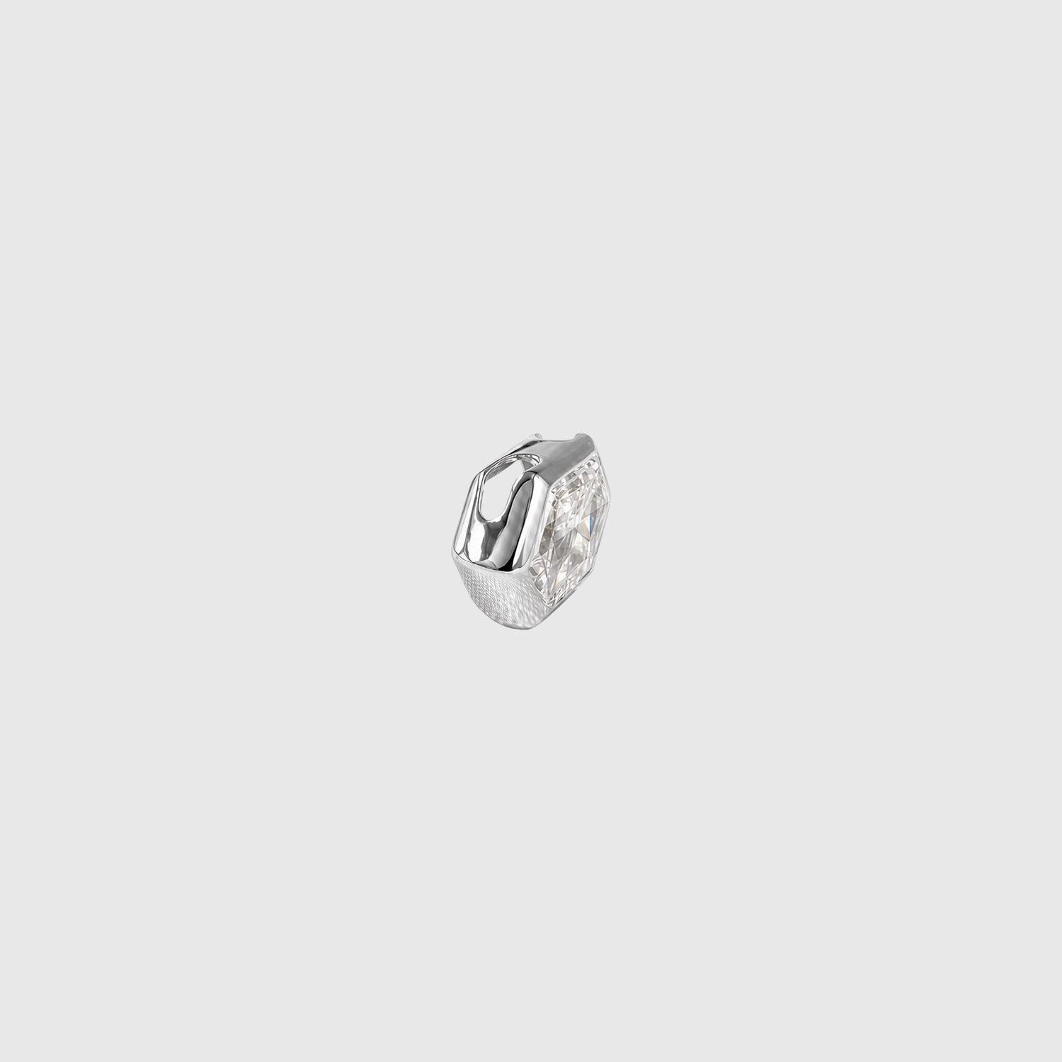Side view of an elongated hexagon-cut diamond pendant in white gold showing the concealed bail and bezel profile.
