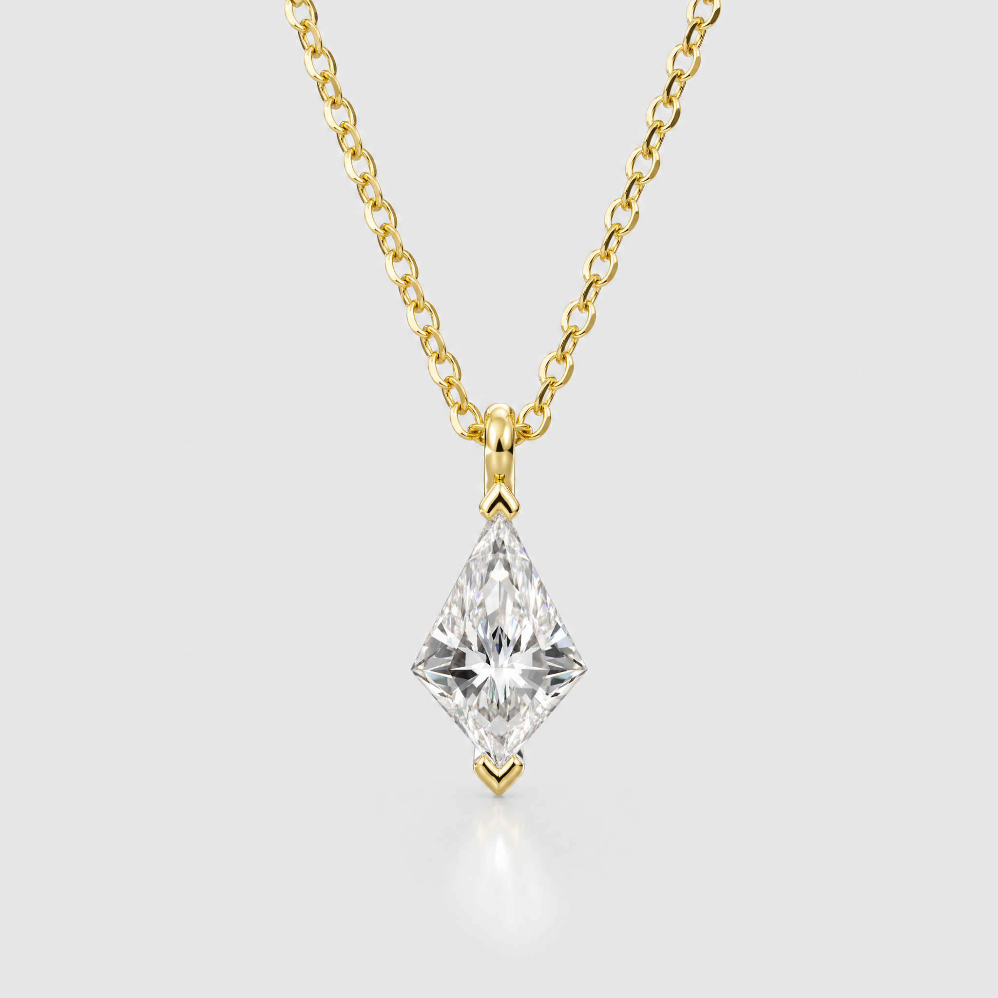 Front view of a kite-cut solitaire pendant in yellow gold displayed on a matching chain.