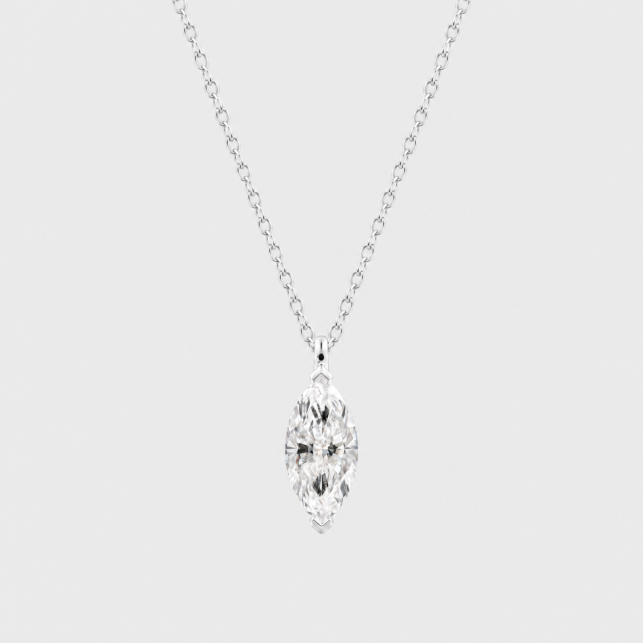 Front view of a marquise-cut solitaire pendant in white metal displayed on a matching chain.