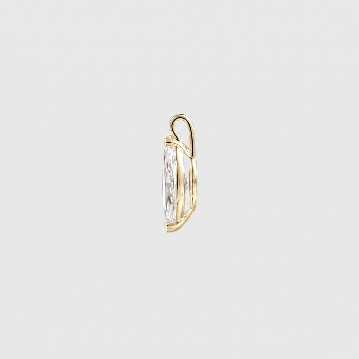 Side view of a marquise-cut solitaire pendant in yellow gold showing the open setting and bail.