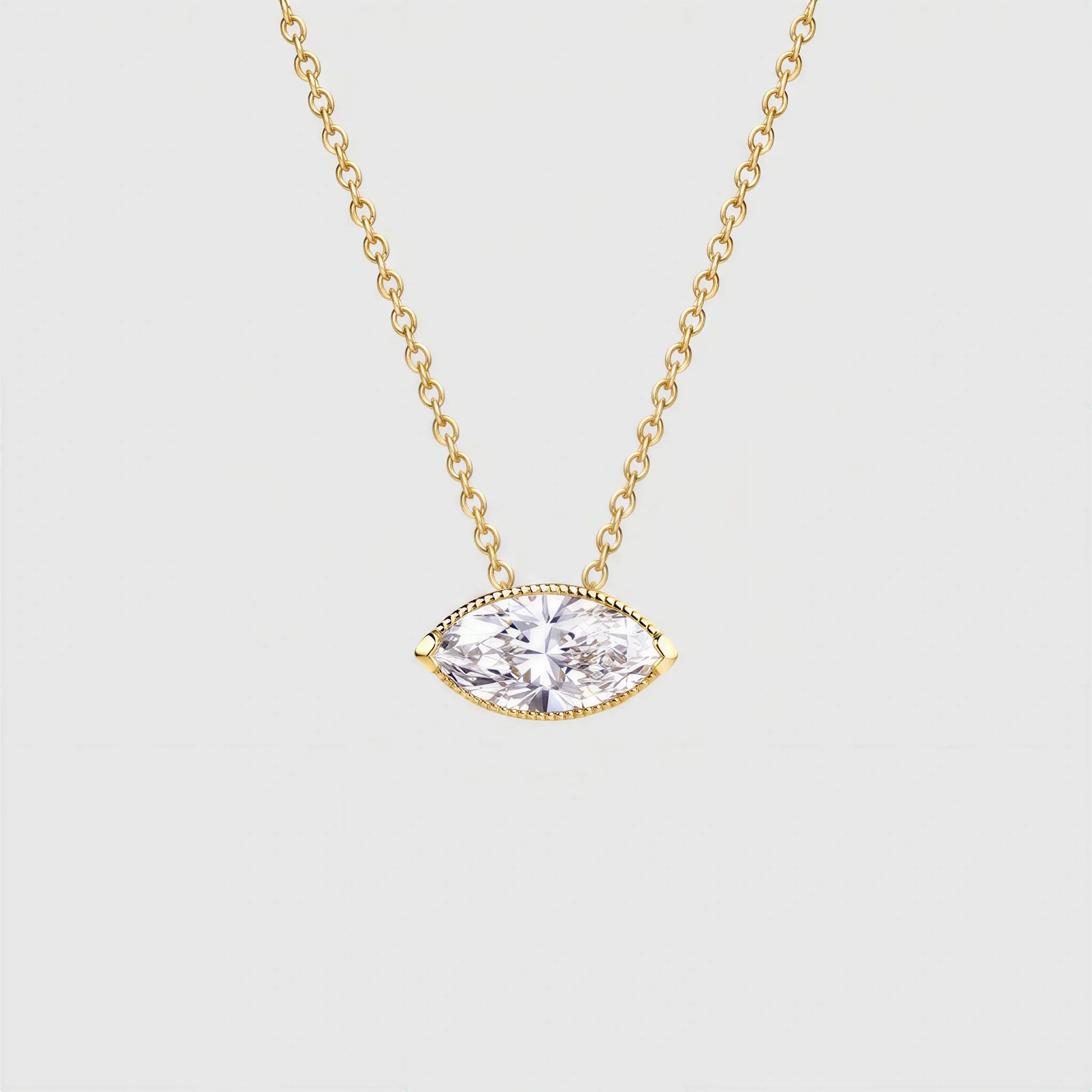 Marquise-cut diamond pendant in yellow gold displayed on a matching fine chain.