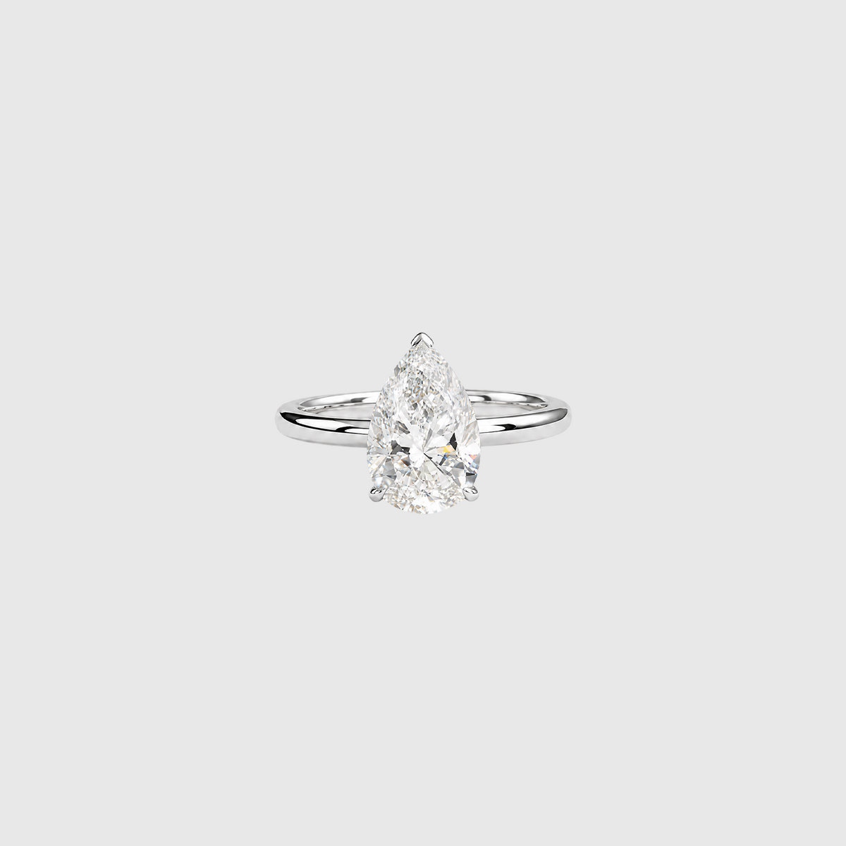 Pear-shaped lab-grown diamond solitaire engagement ring in white gold, front view.