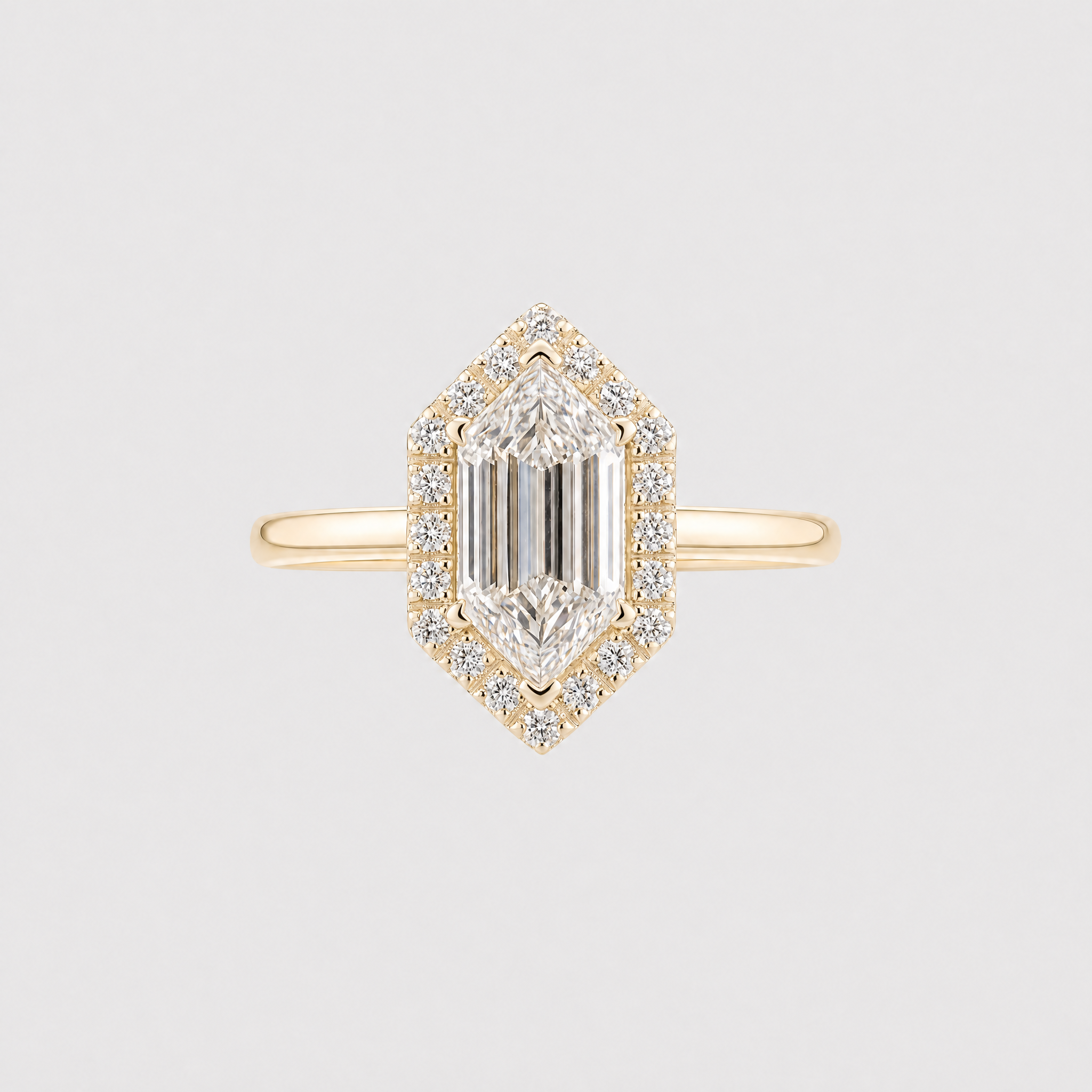 Golden Hexagon diamond with halo setting on a light gray background