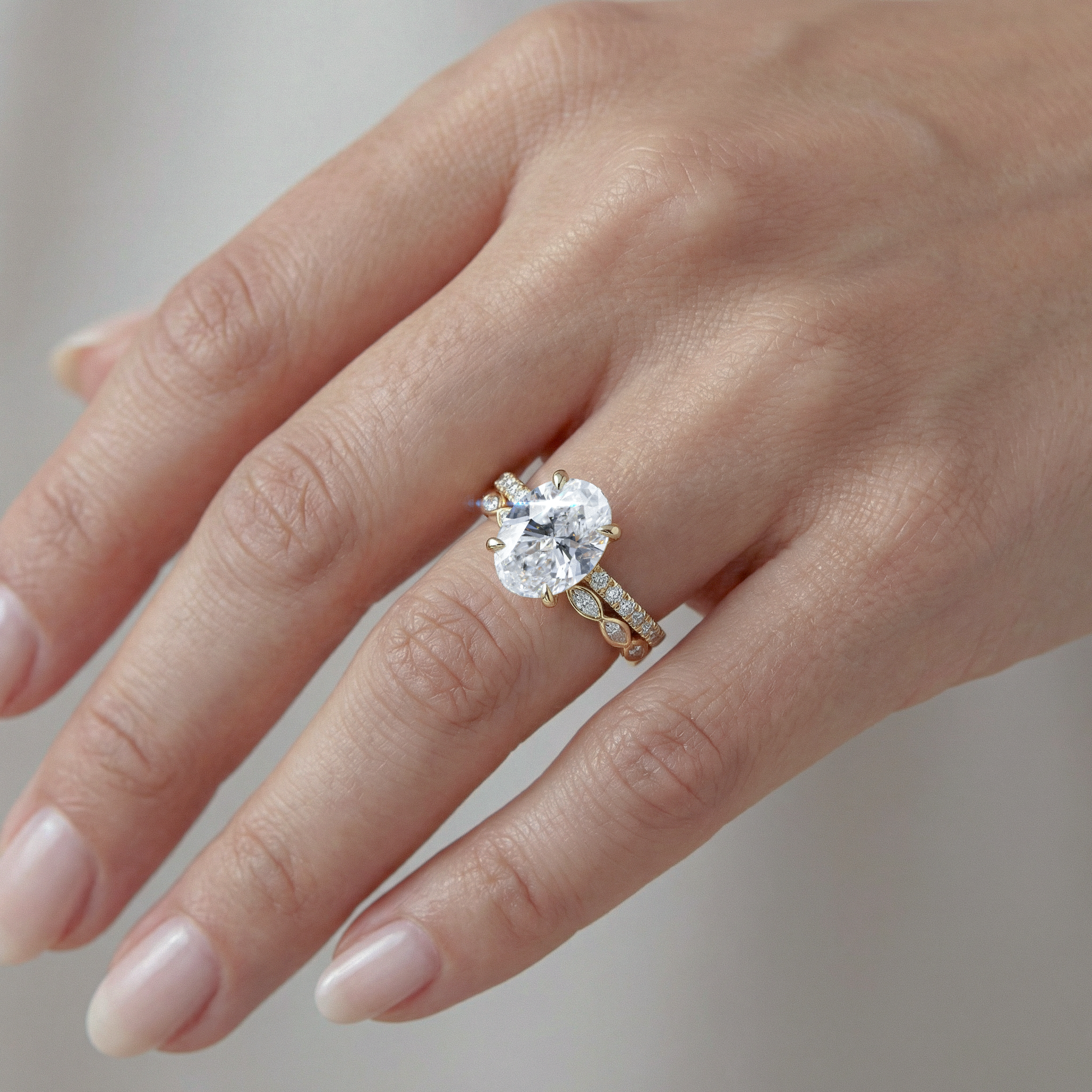Diamond ring on a hand with a blurred background