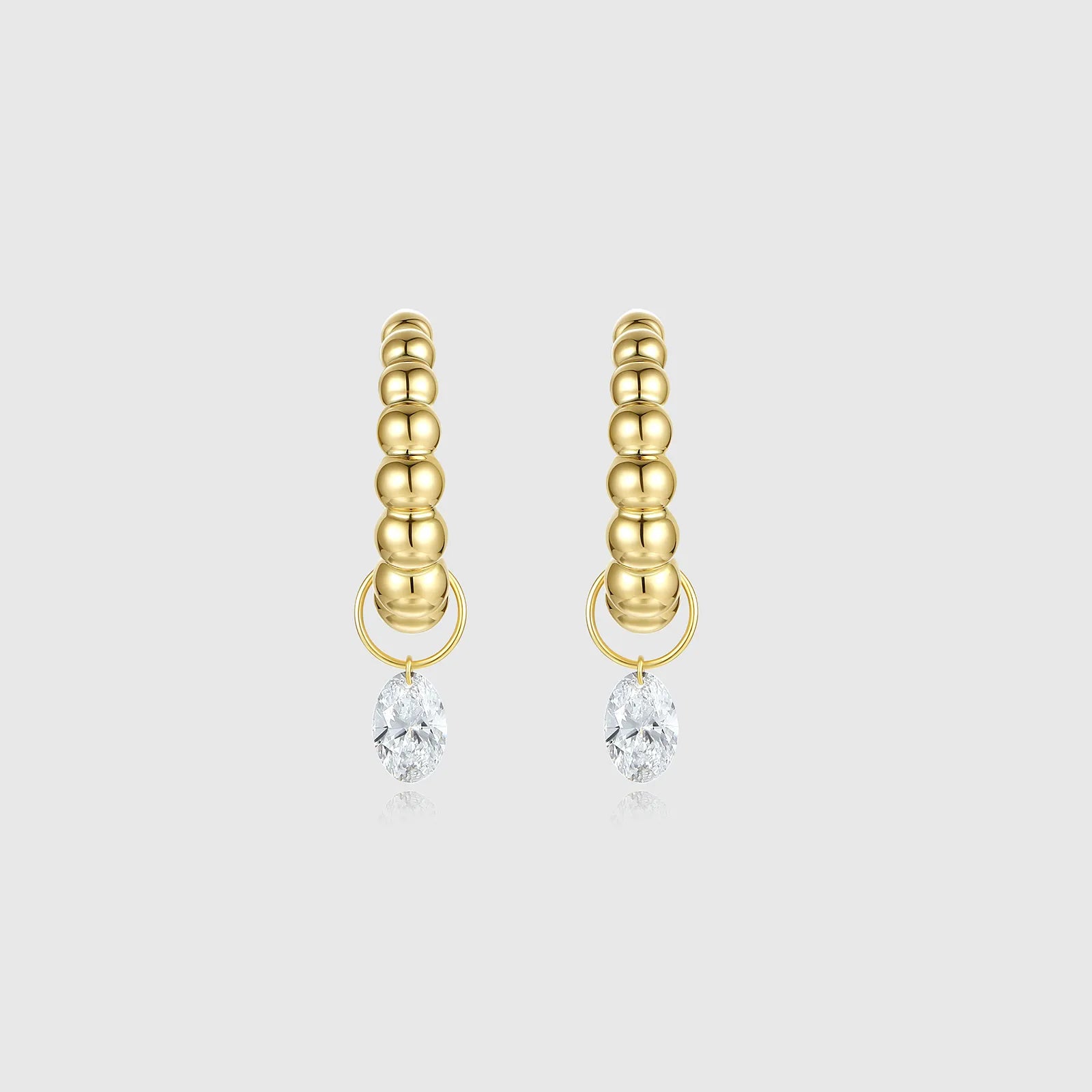 Gold beaded oval-shaped diamond hoop earrings