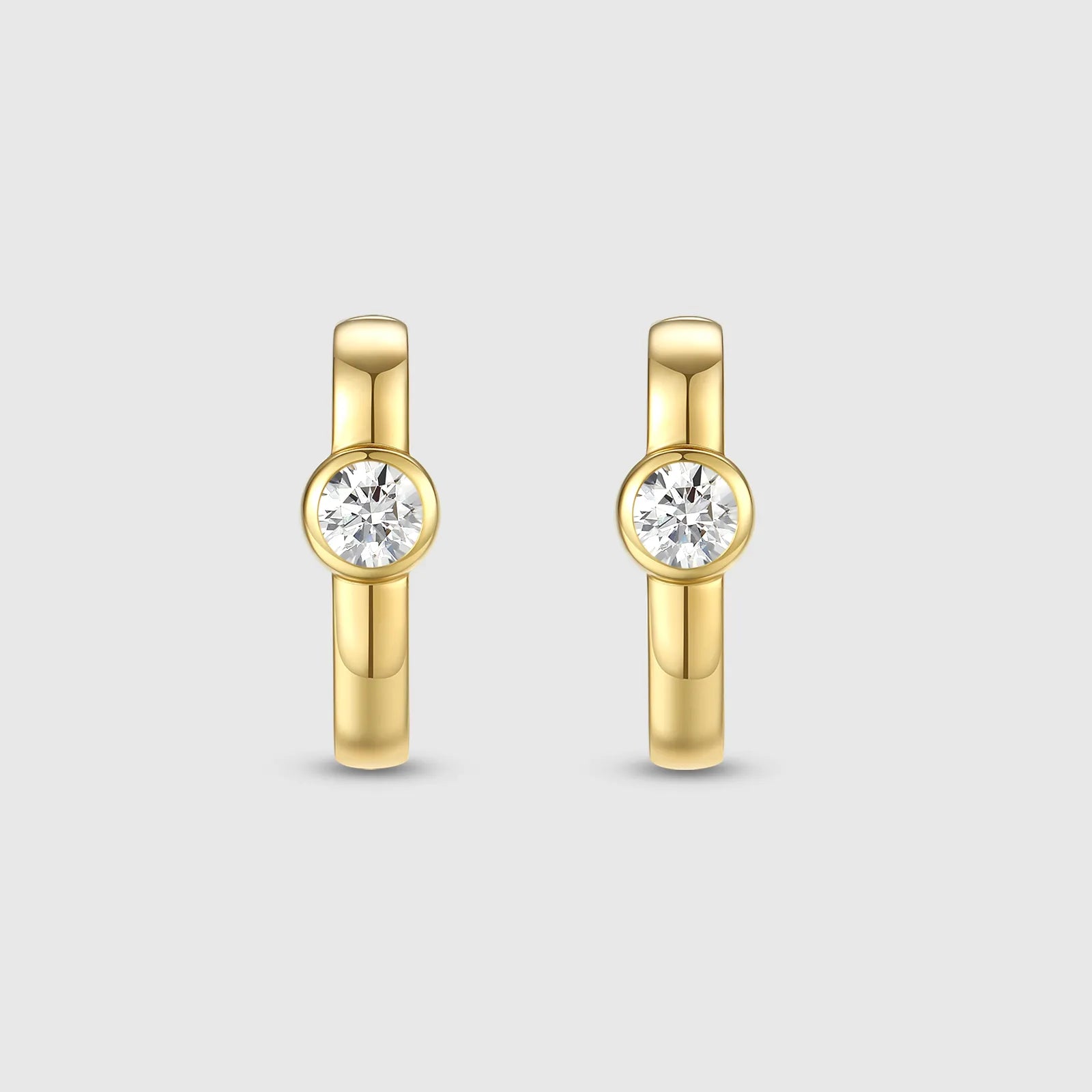 Gold hoop earrings with bezel-set round diamonds