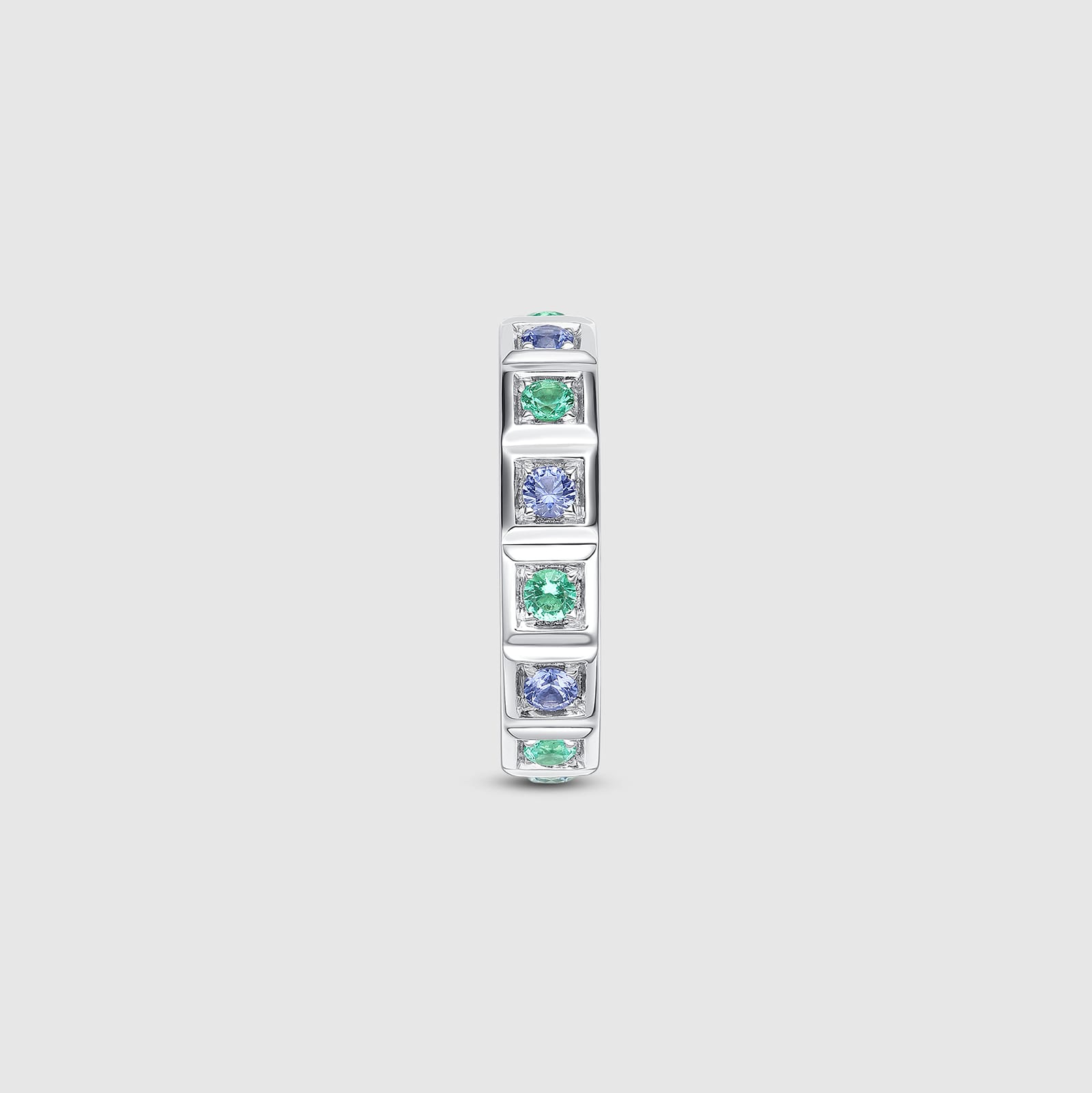 Geometric ring with emerald and sapphire gemstones
