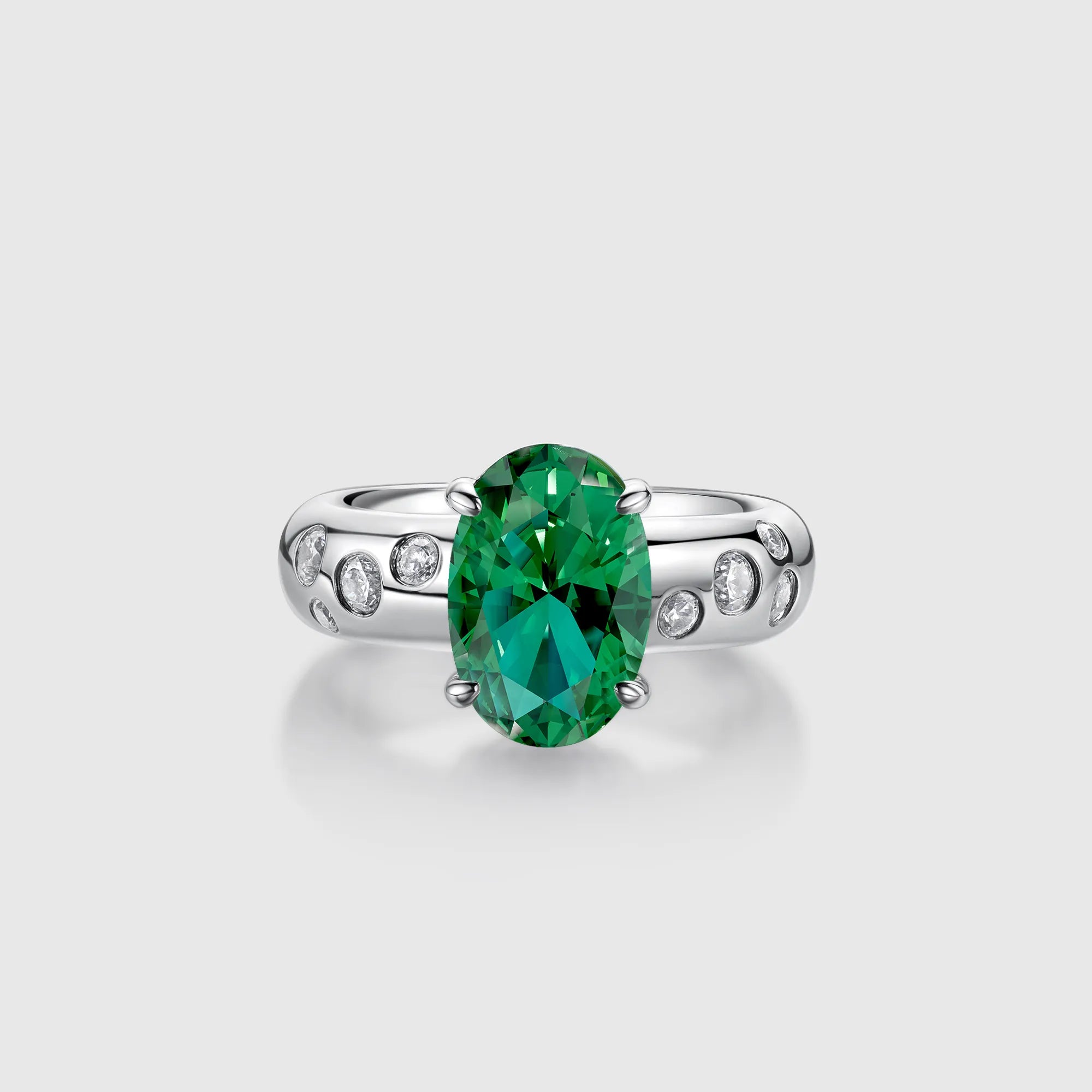 Oval Emerald Engagement Ring with Bezel Side Stones