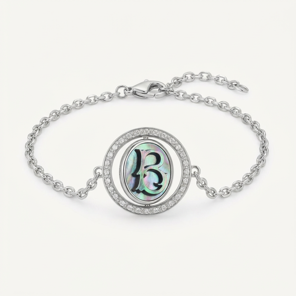 Reversible personalized initial diamond necklace with a black mother-of-pearl background, shown on a 925 sterling silver chain.
