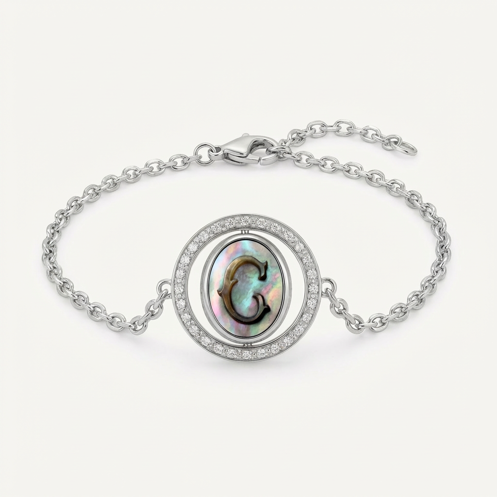 Reversible personalized initial diamond necklace with a black mother-of-pearl background, shown on a 925 sterling silver chain.